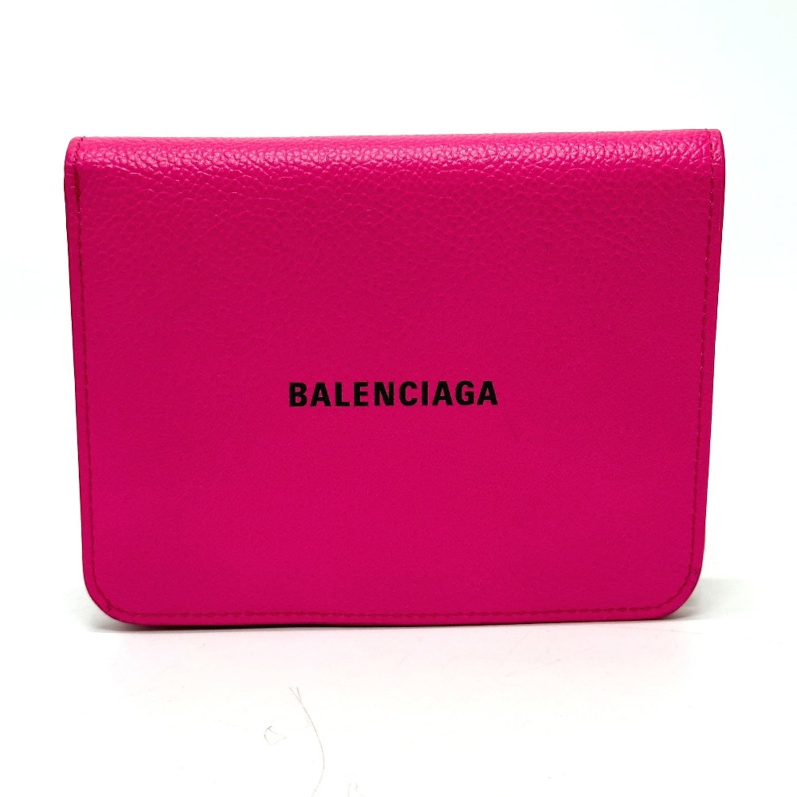 Balenciaga Wallet (Bi-Fold) Leather: Balenciaga Wallet (Bi-Fold) Leather Pink Balenciaga bi-fold leather wallet with a compact size of 13.5cm x 10.5cm and 5.3cm x 4.1cm. This wallet features a signature, adding a touch of elegance to