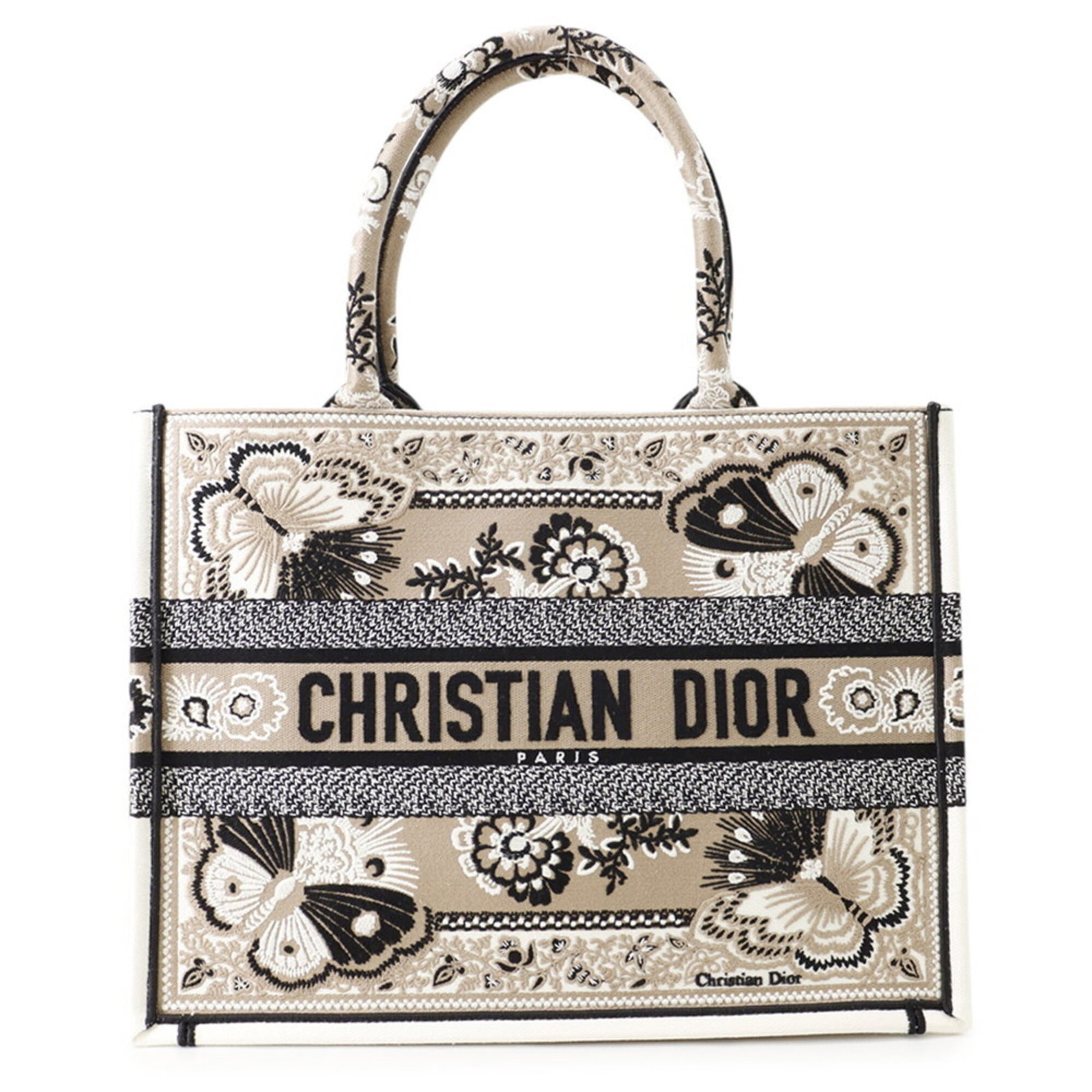 Canvas Dior Tote Christian: Canvas Dior Tote Christian Canvas Dior Tote Christian is a high-quality canvas tote bag with a classic design. Measuring 27cm x 36cm x 15.5cm, it features a beige and white color combination. The bag