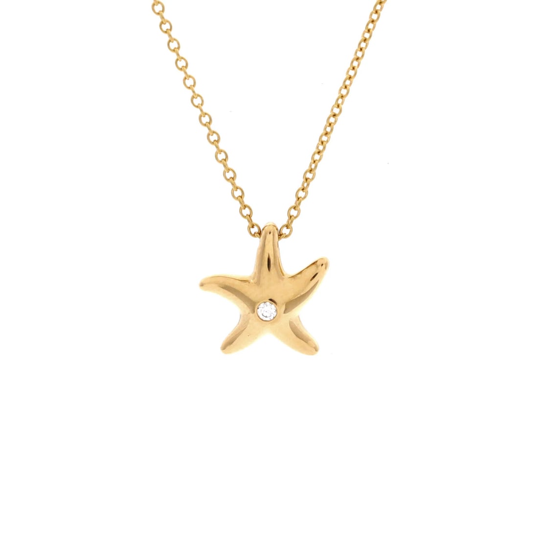 Starfish Pendant Necklace 18K Yellow Gold with Tiffany Diamond: Starfish Pendant Necklace 18K Yellow Gold with Tiffany Diamond 18K Yellow Gold Starfish Pendant Necklace with a stunning Tiffany Diamond. This vintage necklace boasts a beautiful starfish design,