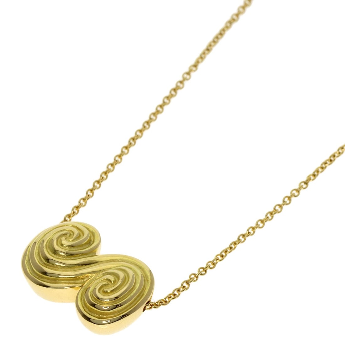 Tornado Necklace Tiffany & Co. K18 Yellow Gold: Tornado Necklace Tiffany & Co. K18 Yellow Gold Tiffany & Co.'s K18 Yellow Gold Tornado Necklace is a striking piece, featuring a unique design that showcases the beauty of gold metal. Made from