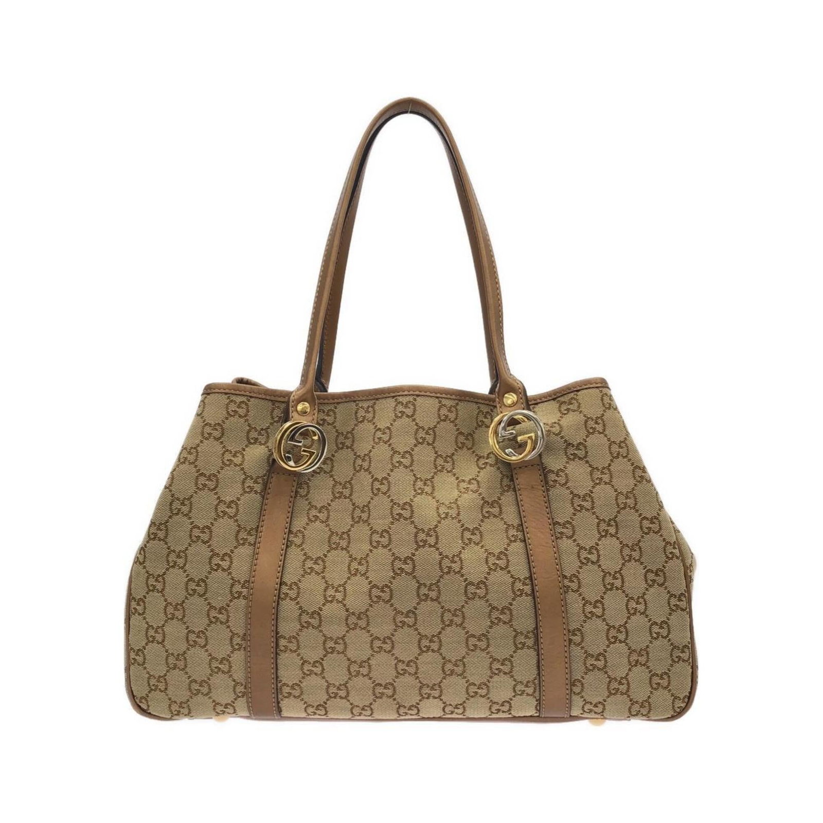Canvas Leather Handbag Gucci: Canvas Leather Handbag Gucci GG canvas and leather come together in this classic Gucci handbag, with a timeless beige color that adds a touch of sophistication. The bag's compact size makes it easy