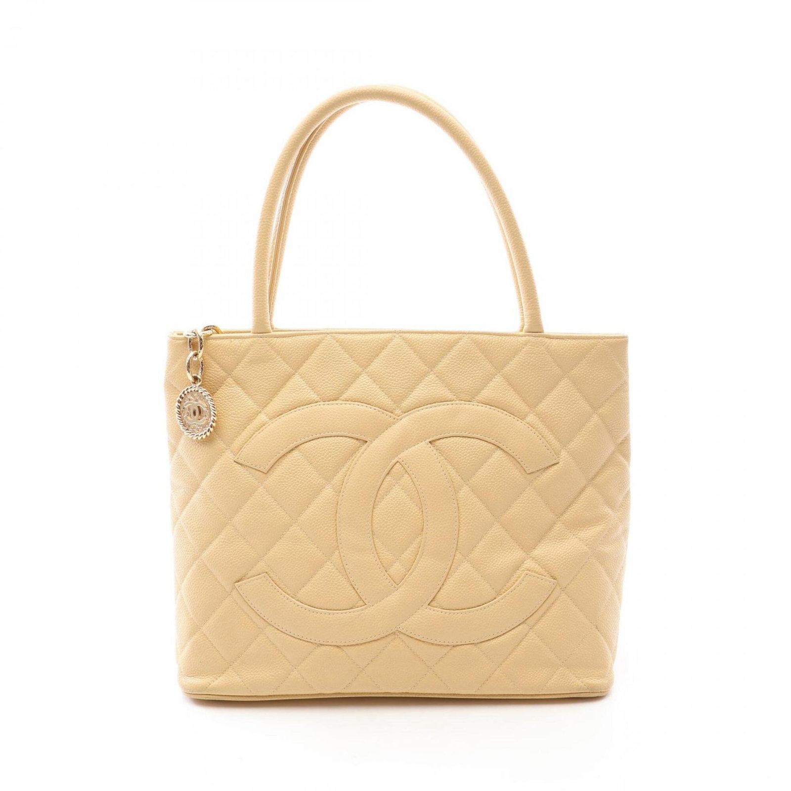 Calfskin Grained Chanel Tote Bag: Calfskin Grained Chanel Tote Bag Calfskin Grained Chanel Tote Bag in Beige. This classic tote bag features a timeless design, made from high-quality grained calfskin material, and boasts a sleek,