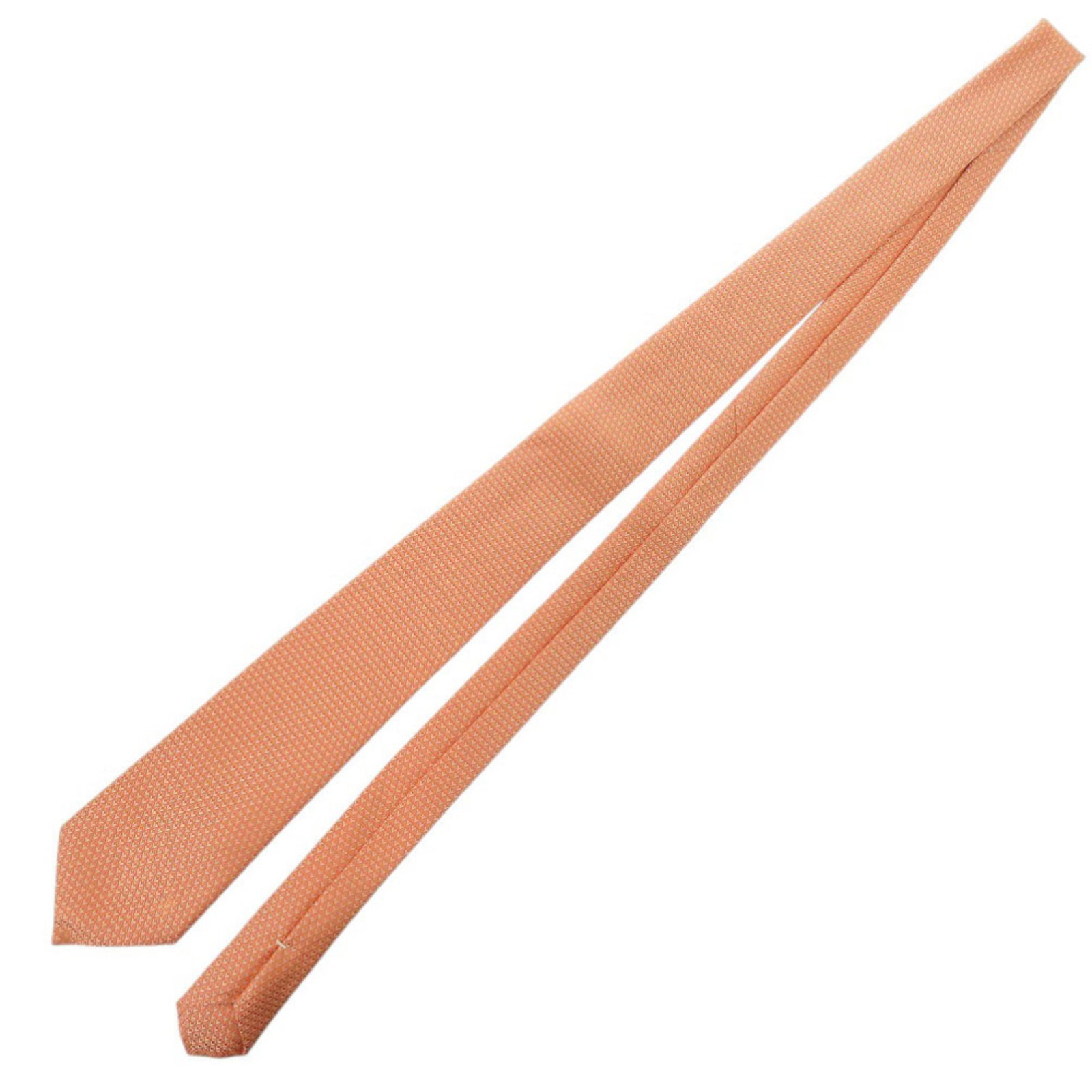 Vuitton Cravat Silk Louis: Vuitton Cravat Silk Louis Silk cravat from Louis Vuitton, made from orange-colored material, features a total length of 148cm and a width of 8cm. This cravat bears a signature and is of Italian origin