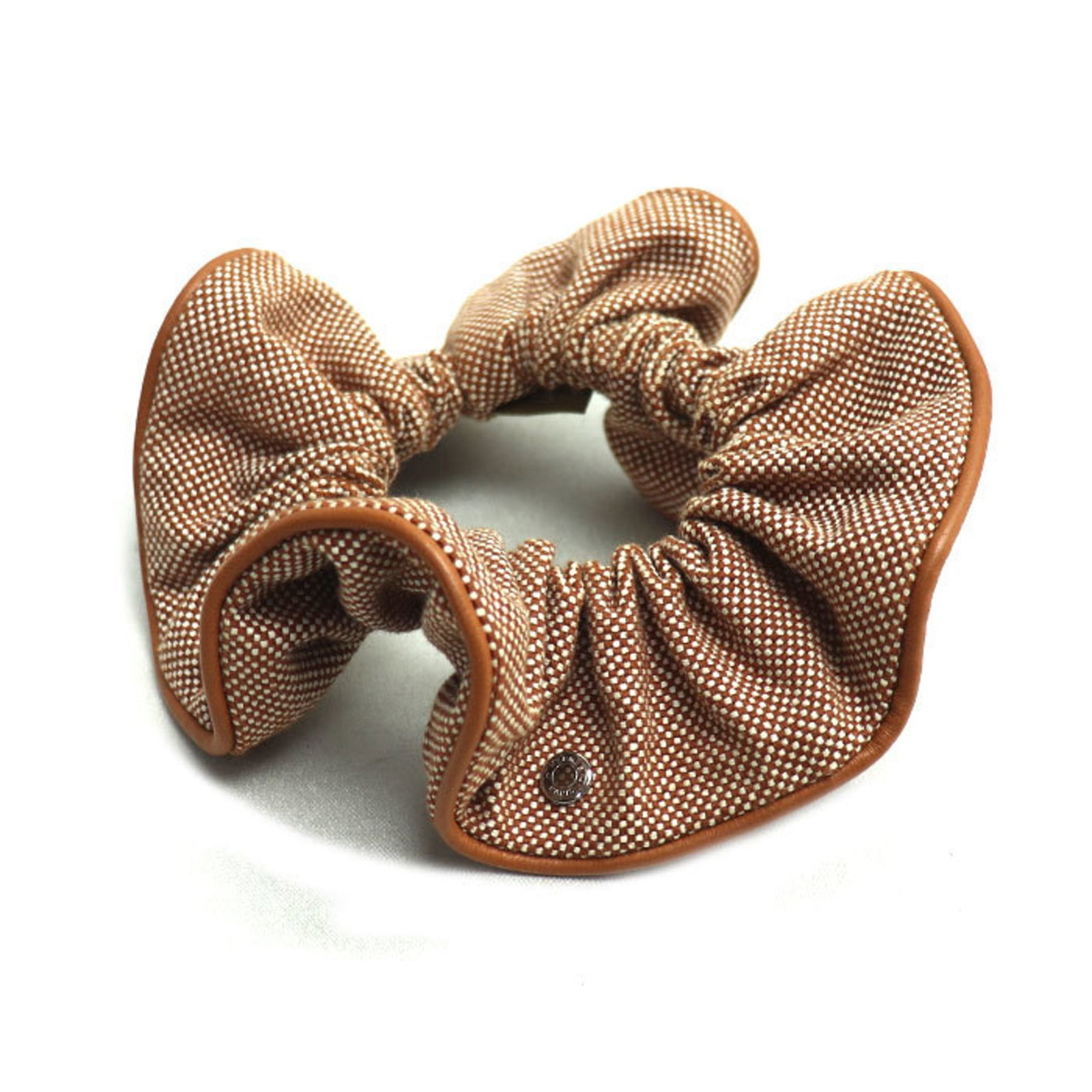 Cotton Leather Scrunchie Hermes: Cotton Leather Scrunchie Hermes Cotton leather scrunchies from Hermes, made with lamb leather, are a unique accessory for women. The brown color and 15cm x 4.59cm size make for a stylish addition to