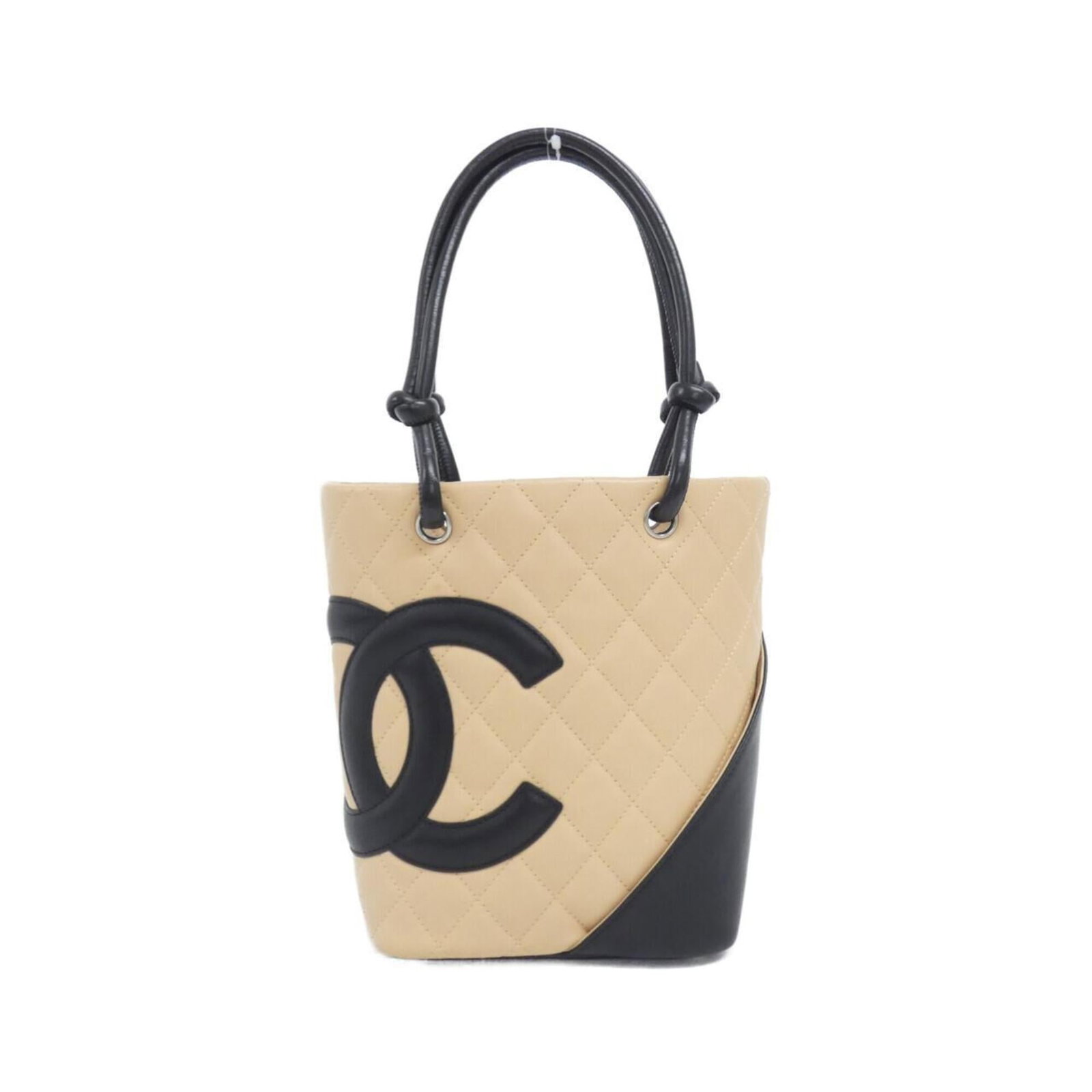 Handbag Leather from Chanel: Handbag Leather from Chanel Chanel's signature style is evident in this exquisite handbag made from high-quality leather, featuring a timeless beige and black color combination. Crafted from durable