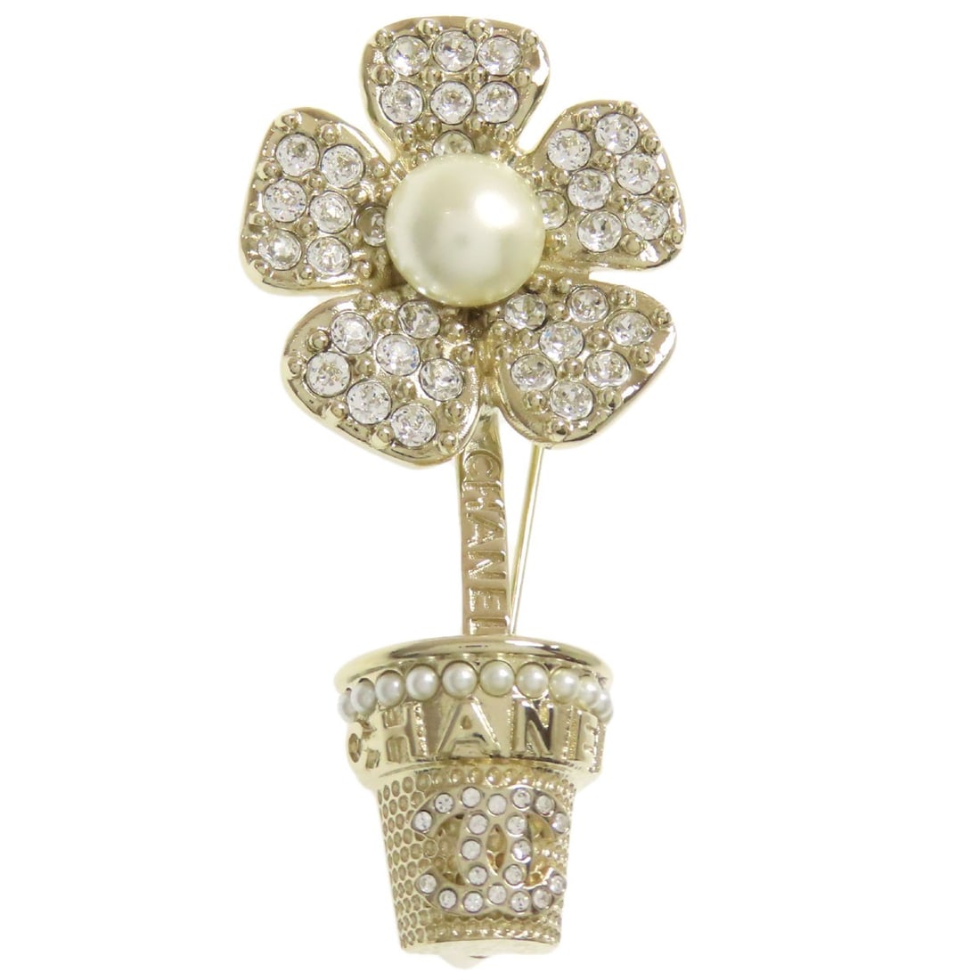 Metal Chanel Flour Brooch: Metal Chanel Flour Brooch Gold metal brooch from CHANEL, featuring a classic design with a gold exterior. This metal brooch is a stylish accessory that adds a touch of luxury to any outfit. Item Speci