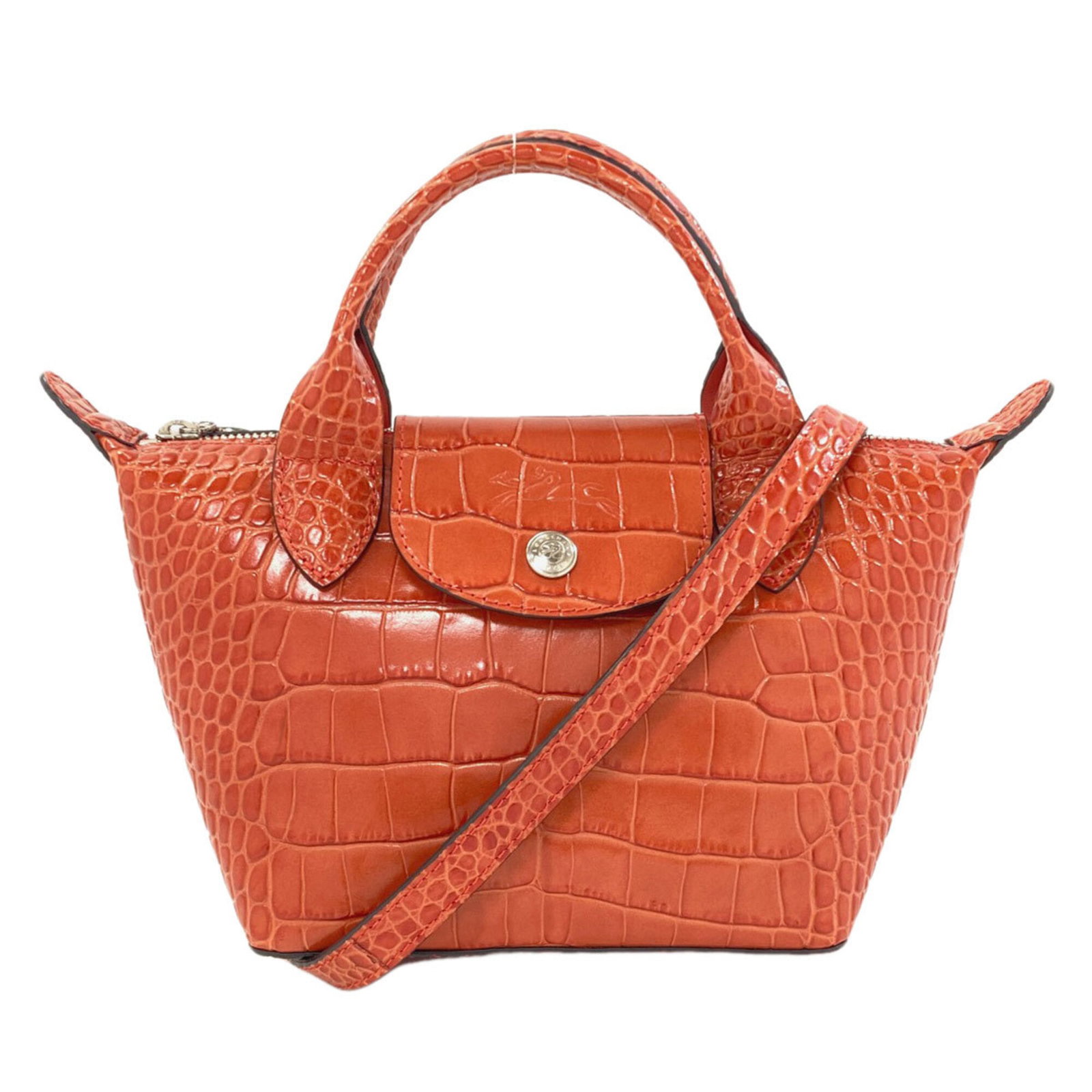 Longchamp Handbag Leather: Longchamp Handbag Leather Brown and Orange Embossed Leather Handbag. This Longchamp Le Pliage handbag features embossed leather in a unique brown and orange color combination. With its 15.5cm x