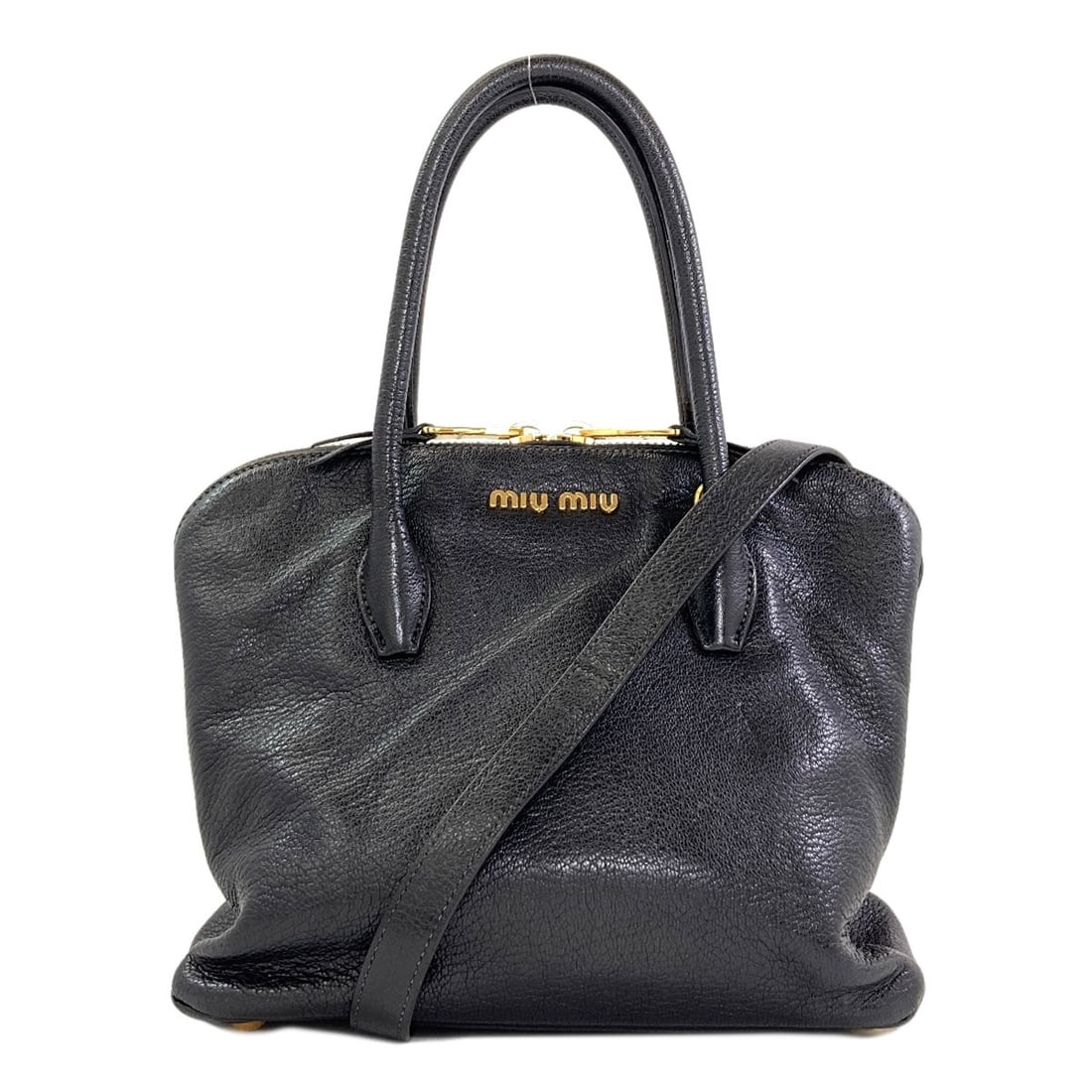 Handbag Leather 2Way Miumiu: Handbag Leather 2Way Miumiu The MIUMIU Handbag is a sleek and sophisticated black leather bag with a 9.1 inch height and 6.1 inch depth. Its open closure and detachable strap make it a versatile