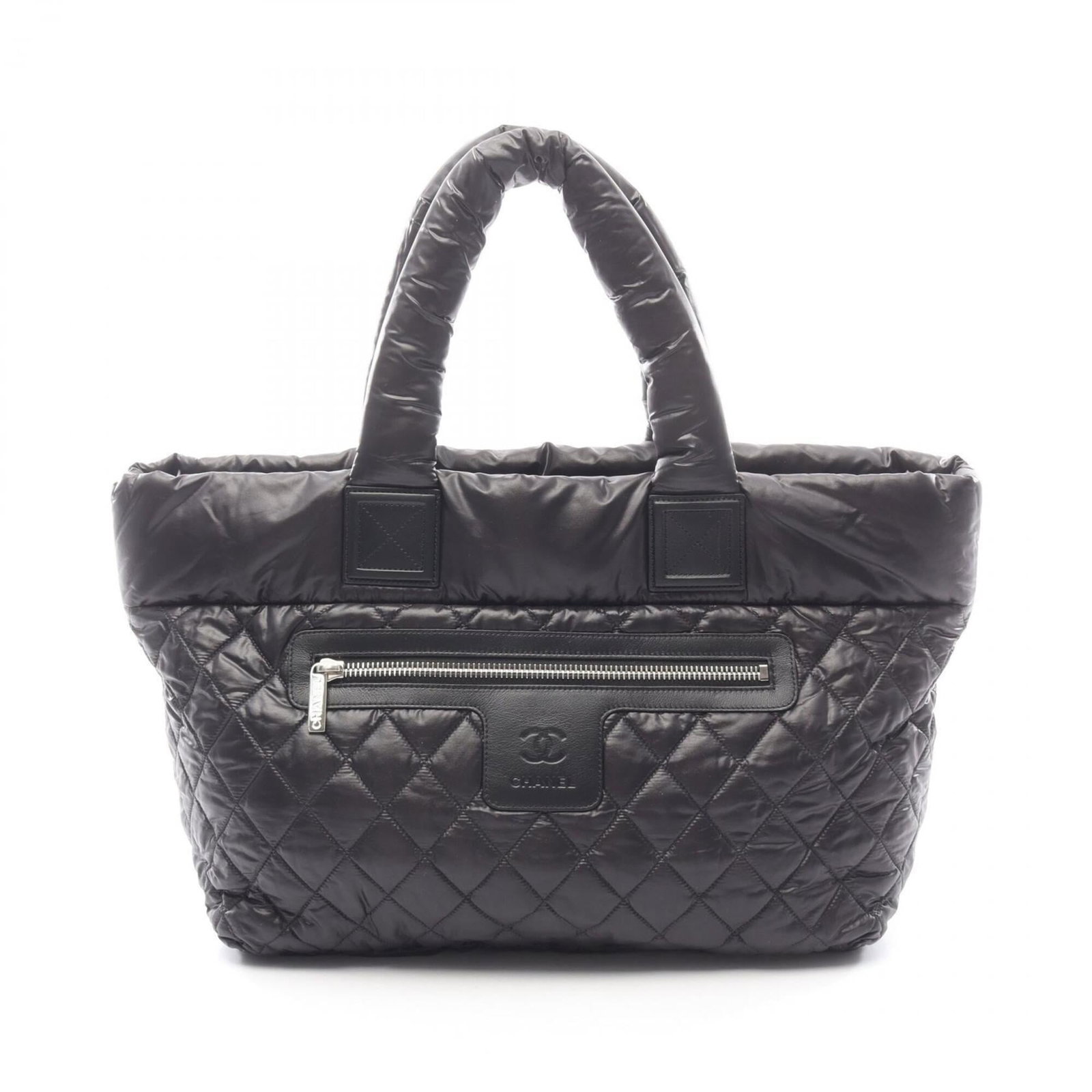 Nylon Leather Tote Chanel Bag Handbag: Nylon Leather Tote Chanel Bag Handbag Nylon Leather Tote Bag from Chanel, featuring a classic design with a black color and silver hardware. This tote bag measures 29cm x 38cm x 18cm and is made from