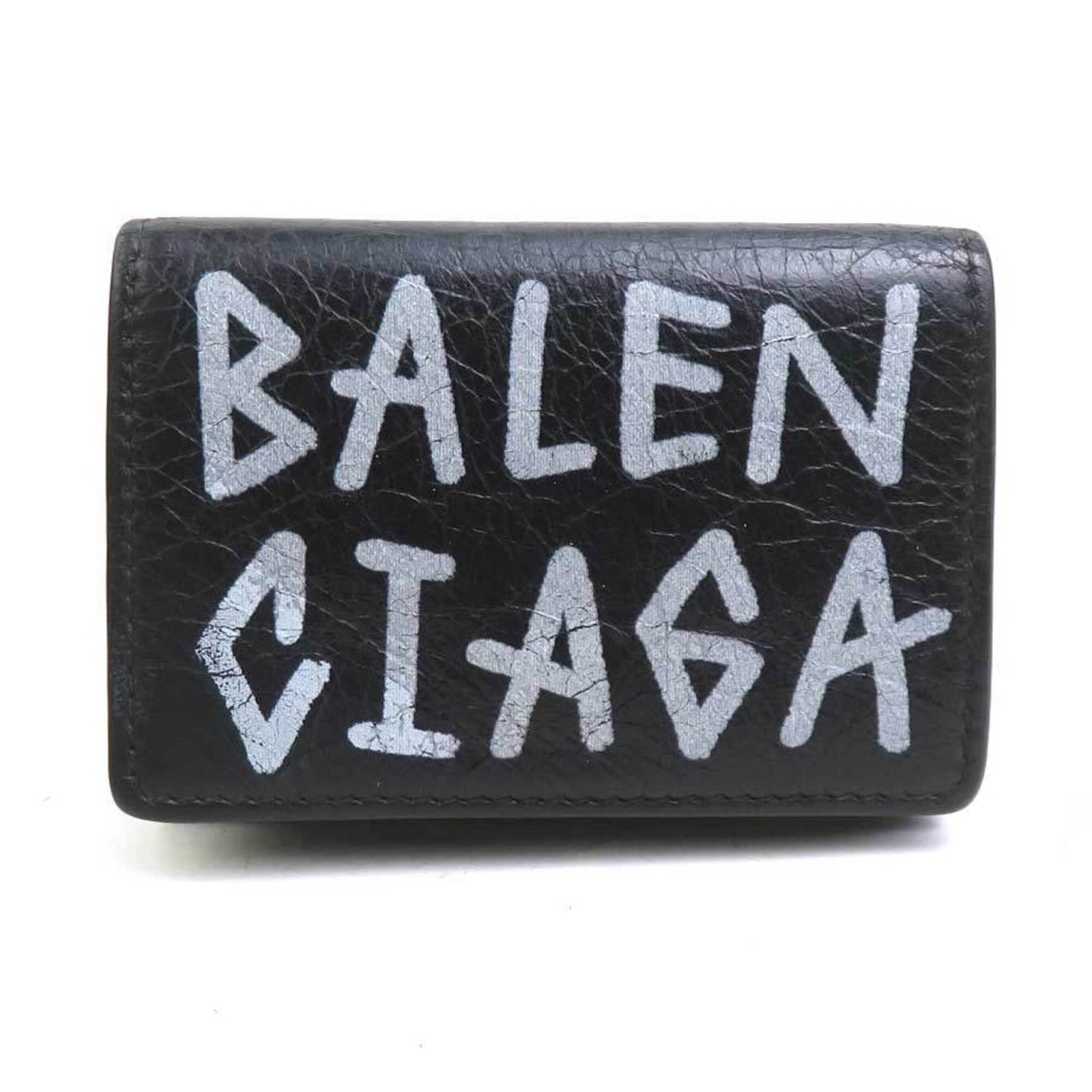 Balenciaga Wallet (Tri-Fold) Leather: Balenciaga Wallet (Tri-Fold) Leather The Balenciaga tri-fold leather wallet is a sleek and sophisticated accessory, boasting a classic design with clean lines and a timeless black leather finish.