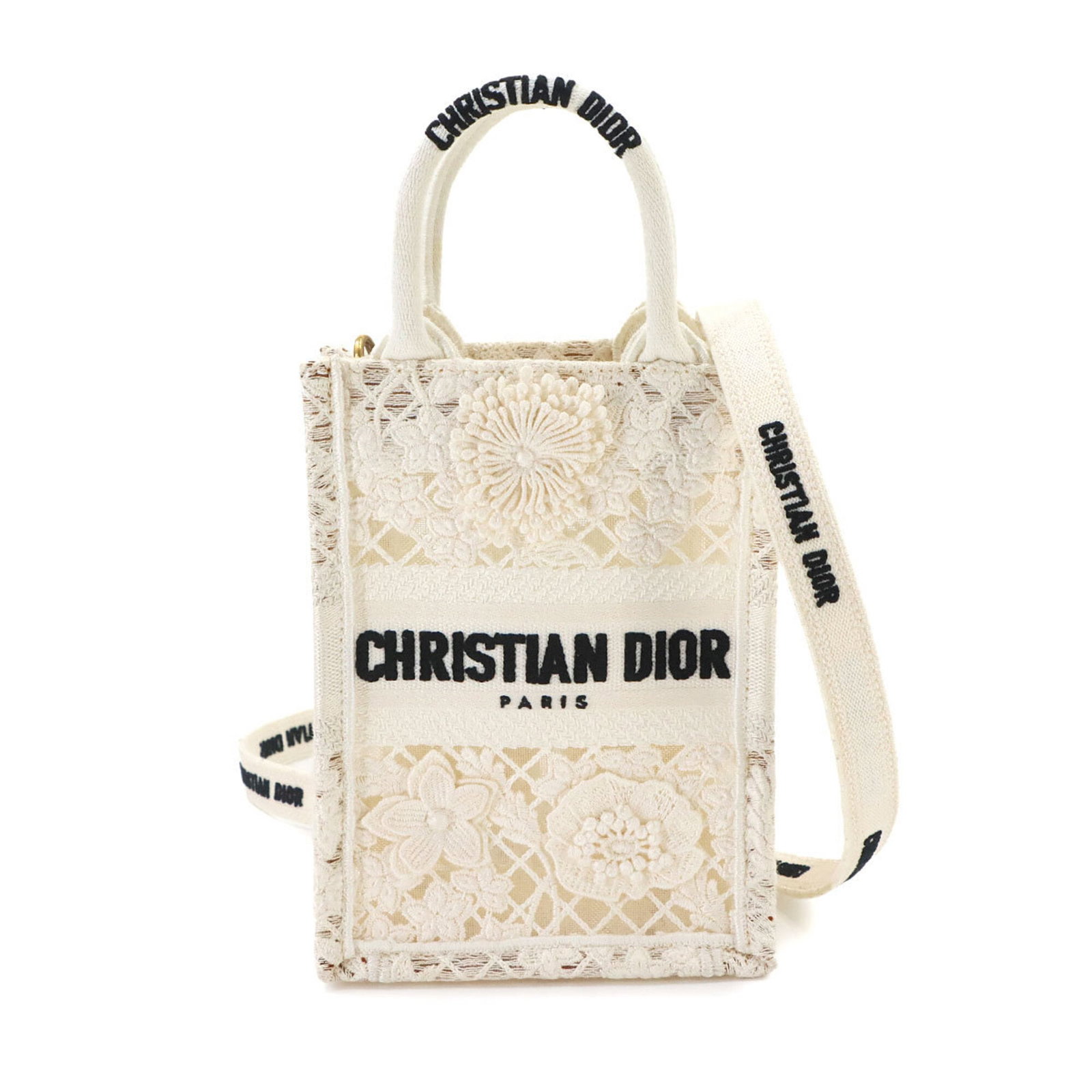 Handbag Canvas Dior Tote Christian: Handbag Canvas Dior Tote Christian White canvas Dior tote bag with a classic design, bearing a signature. Made from high-quality canvas, this bag measures 18cm x 13cm x 7.5cm. Its timeless style
