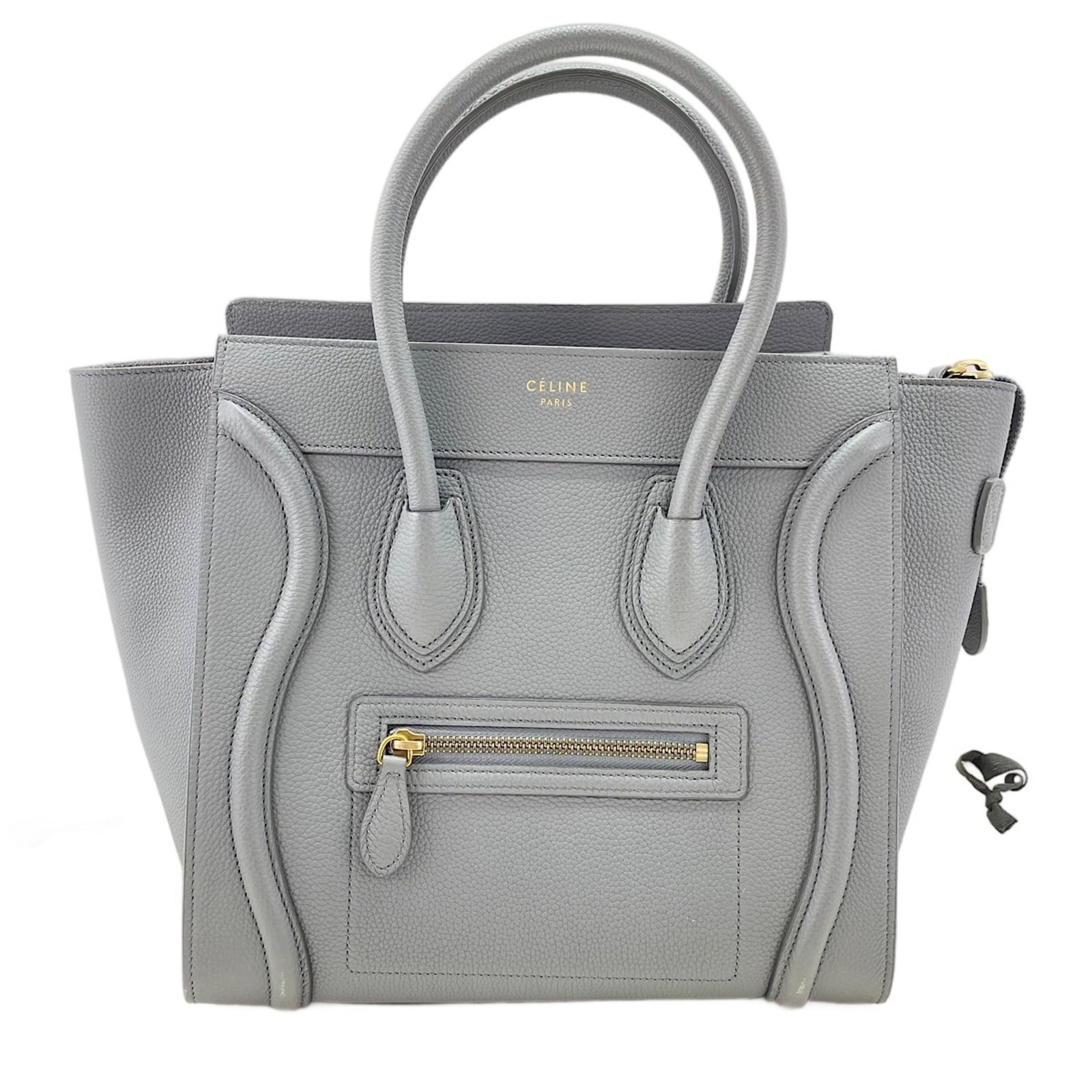 Handbag Celine: Handbag Celine Gray Celine handbag with dimensions 25cm x 26.5cm x 14cm, originating from Italy. This women's handbag features a sleek design and a compact size, making it a practical choice for