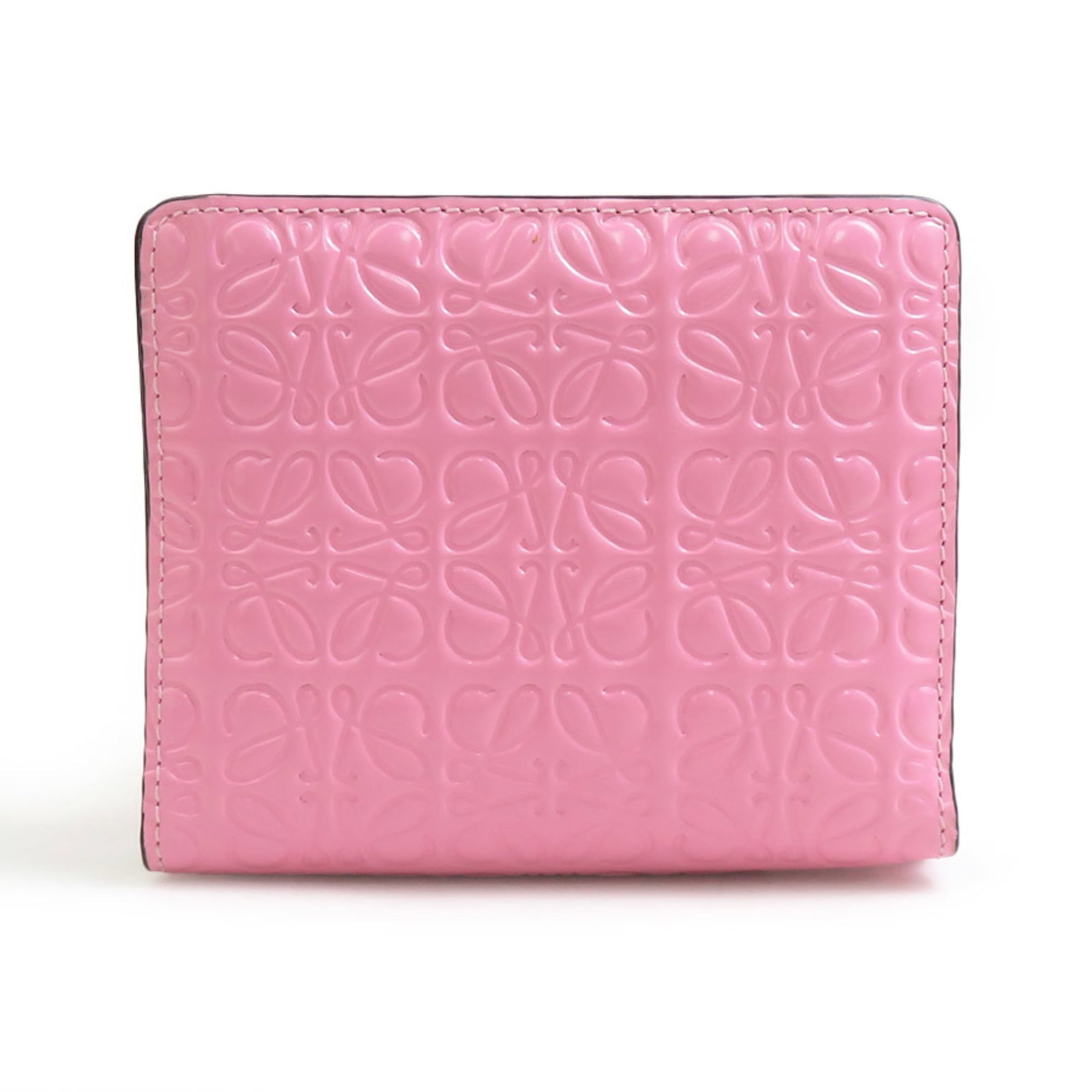 Coated Canvas Loewe Bi Fold Wallet: Coated Canvas Loewe Bi Fold Wallet Coated canvas Loewe Bi Fold Wallet in pink, featuring a stylish design with a 9cm x 10.8cm x 2cm size. This bi-fold wallet is made from coated canvas, a durable and 