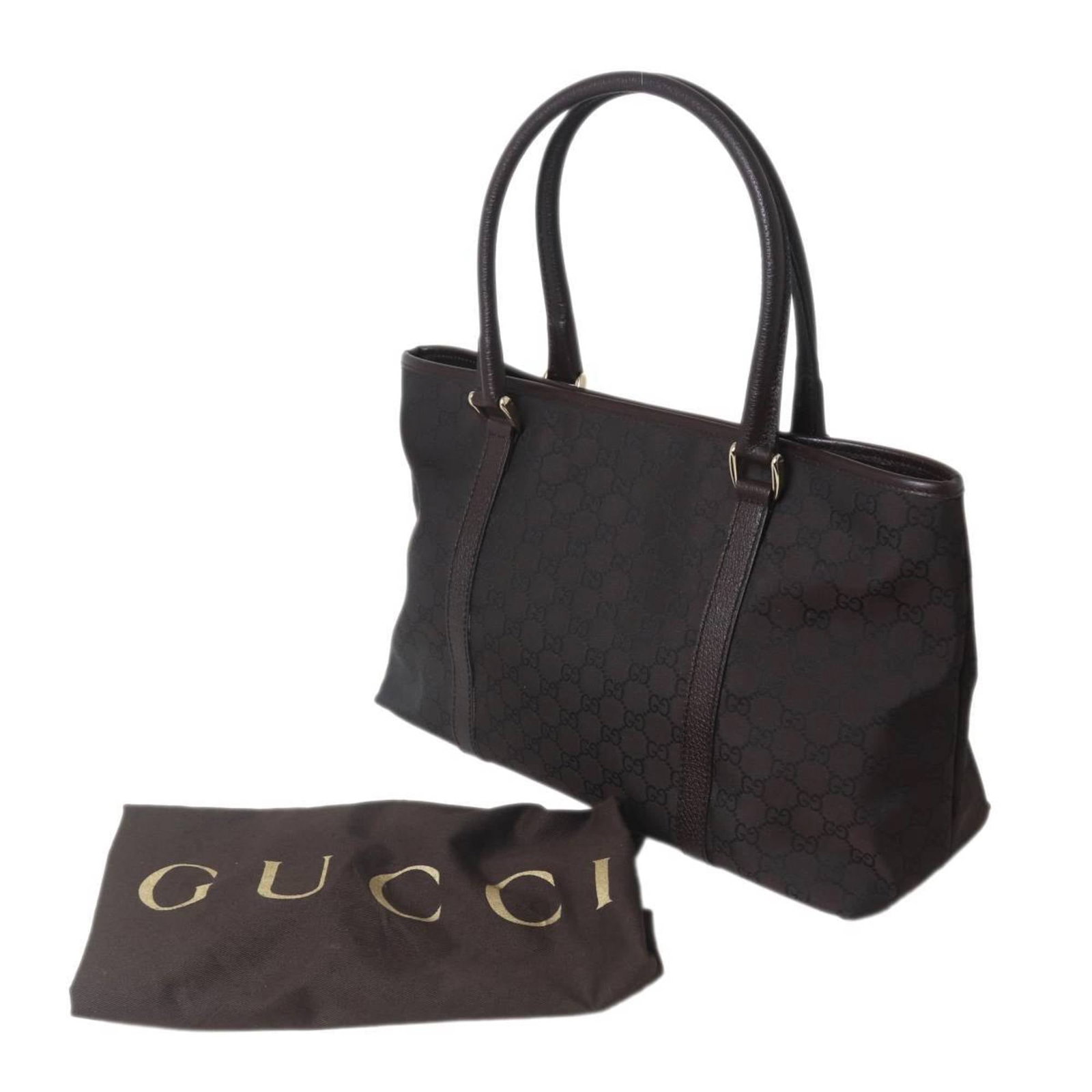 Canvas Gg Bag Tote Gucci: Canvas Gg Bag Tote Gucci Canvas GG Bag Tote in Brown. This Gucci tote bag features the iconic GG canvas material and a classic design. Made in the signature Gucci style, this bag boasts a timeless