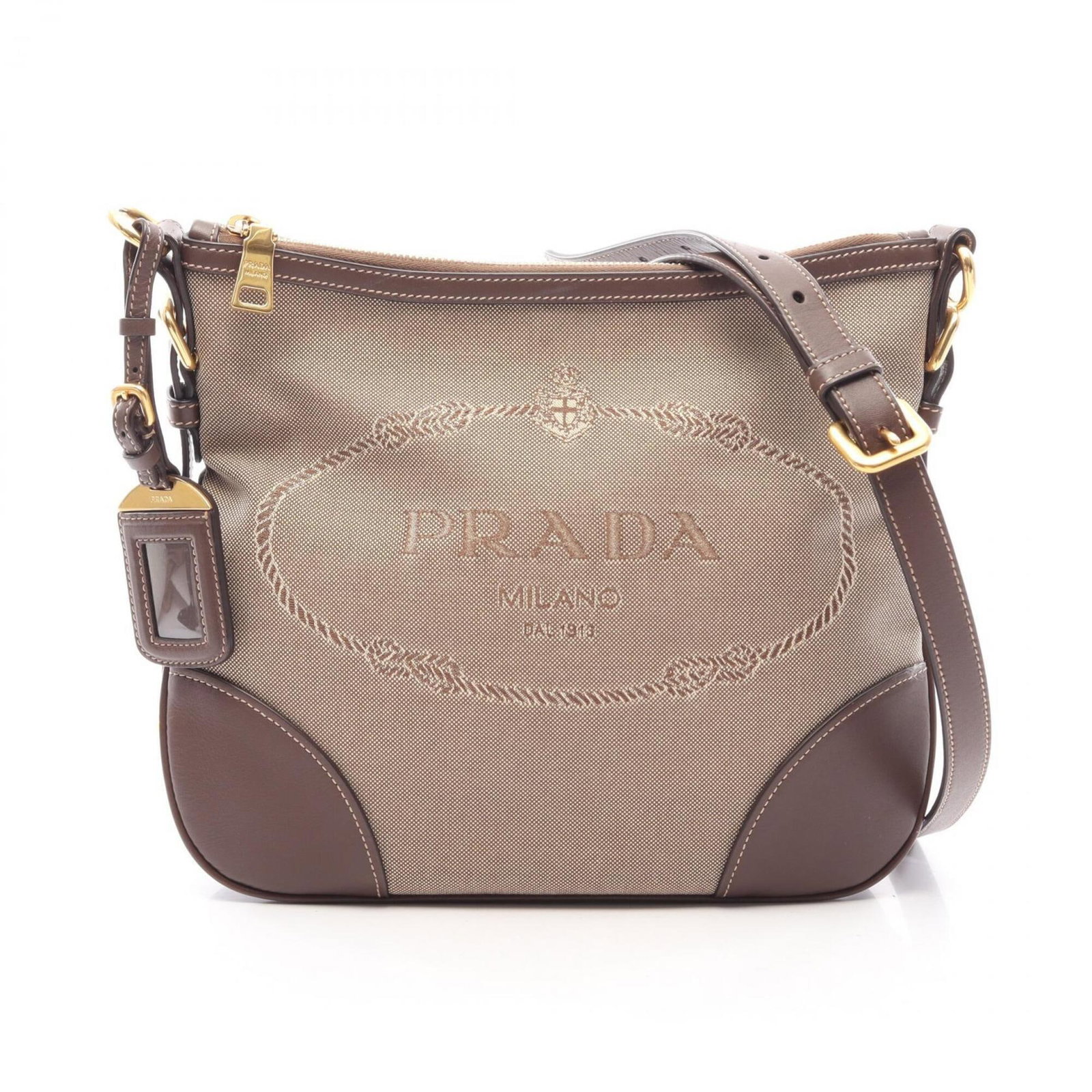 Canvas Leather Shoulder Bag Handbag Prada: Canvas Leather Shoulder Bag Handbag Prada Canvas Leather Shoulder Bag Prada - A Timeless Beige and Brown Classic. This Prada shoulder bag is crafted from high-quality canvas and leather, featuring a