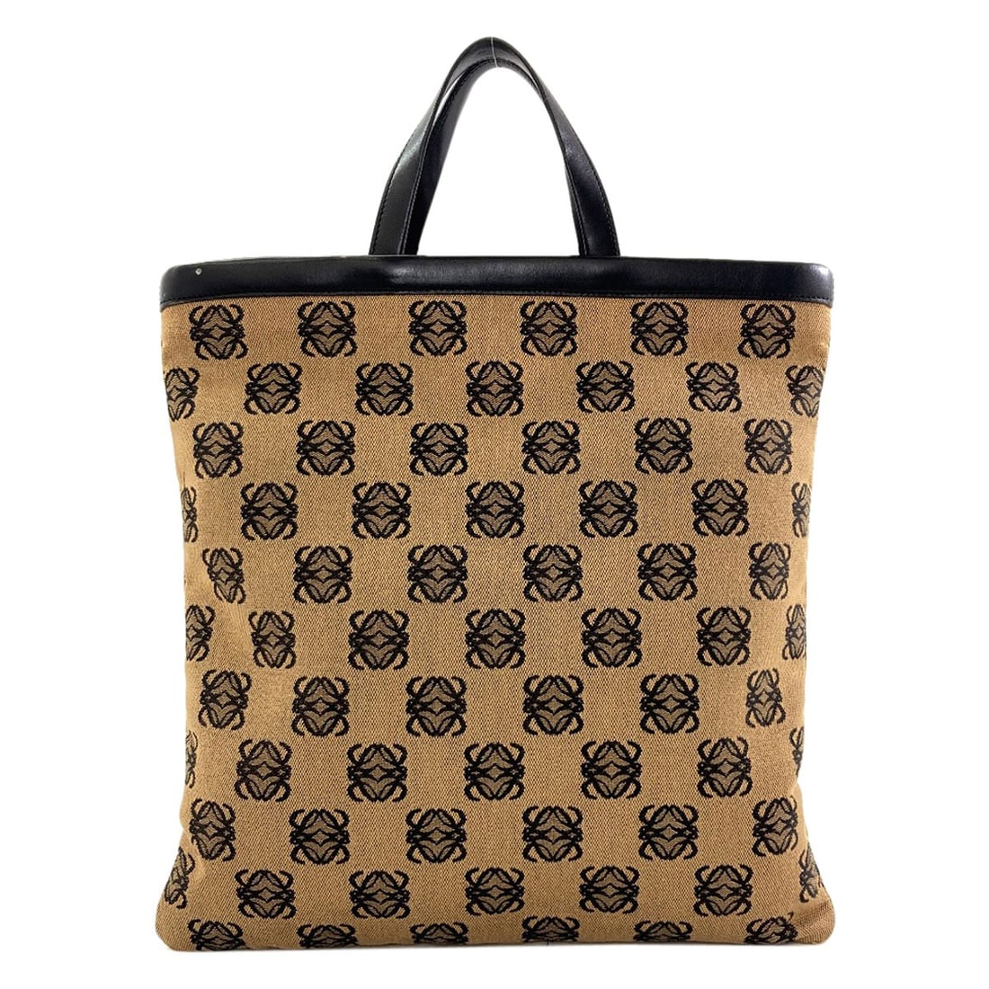 Loewe Anagram Tote Bag Canvas: Loewe Anagram Tote Bag Canvas Brown canvas tote bag with a magnetic closure, measuring 13.2 inches in height and 12.6 inches in width, made from canvas material. The bag features a simple, understated