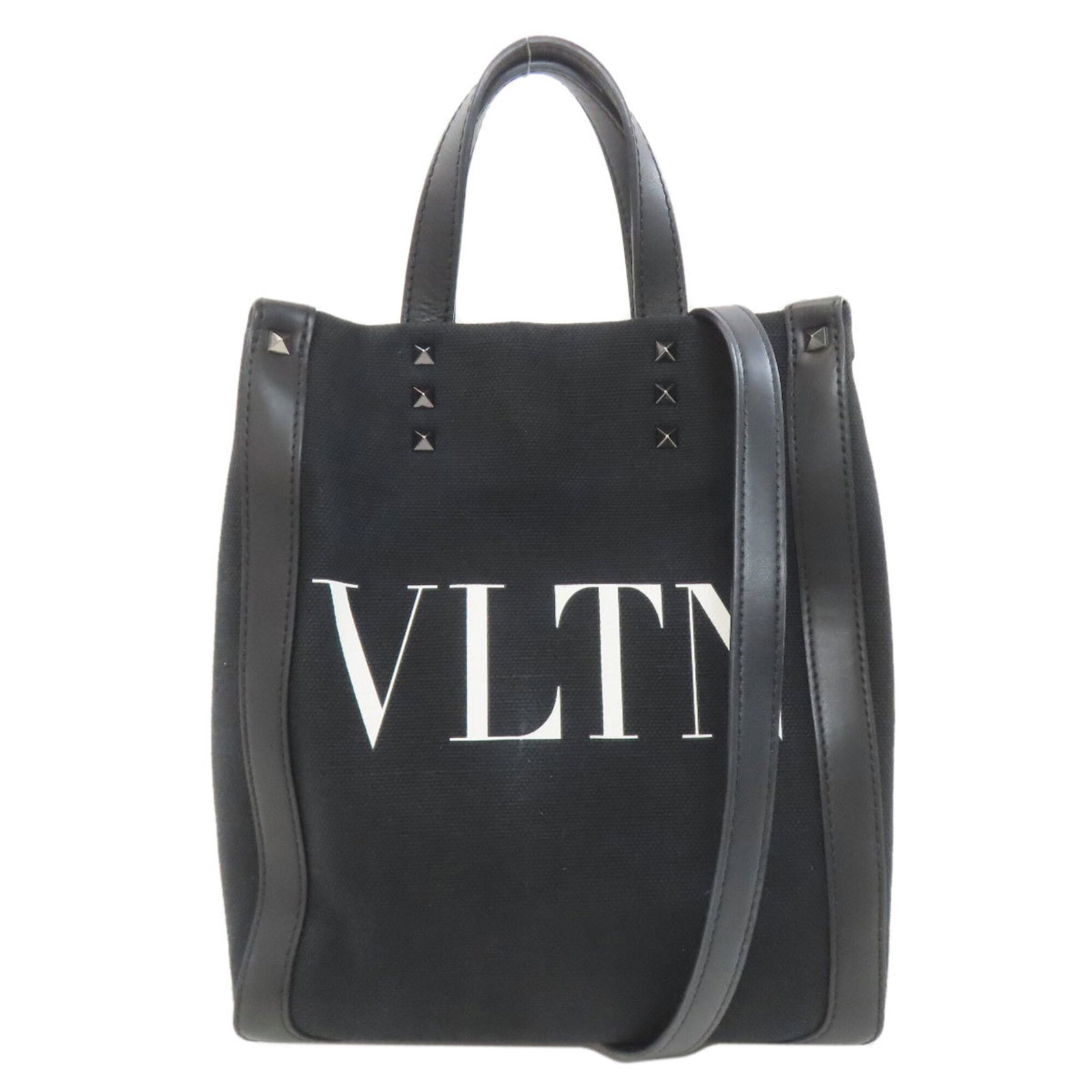 Canvas Valentino Handbag: Canvas Valentino Handbag Canvas Valentino Handbag stands out with its sleek black canvas design, featuring a signature that bears a mark of the brand. Measuring 25cm x 21cm x 8cm, this compact
