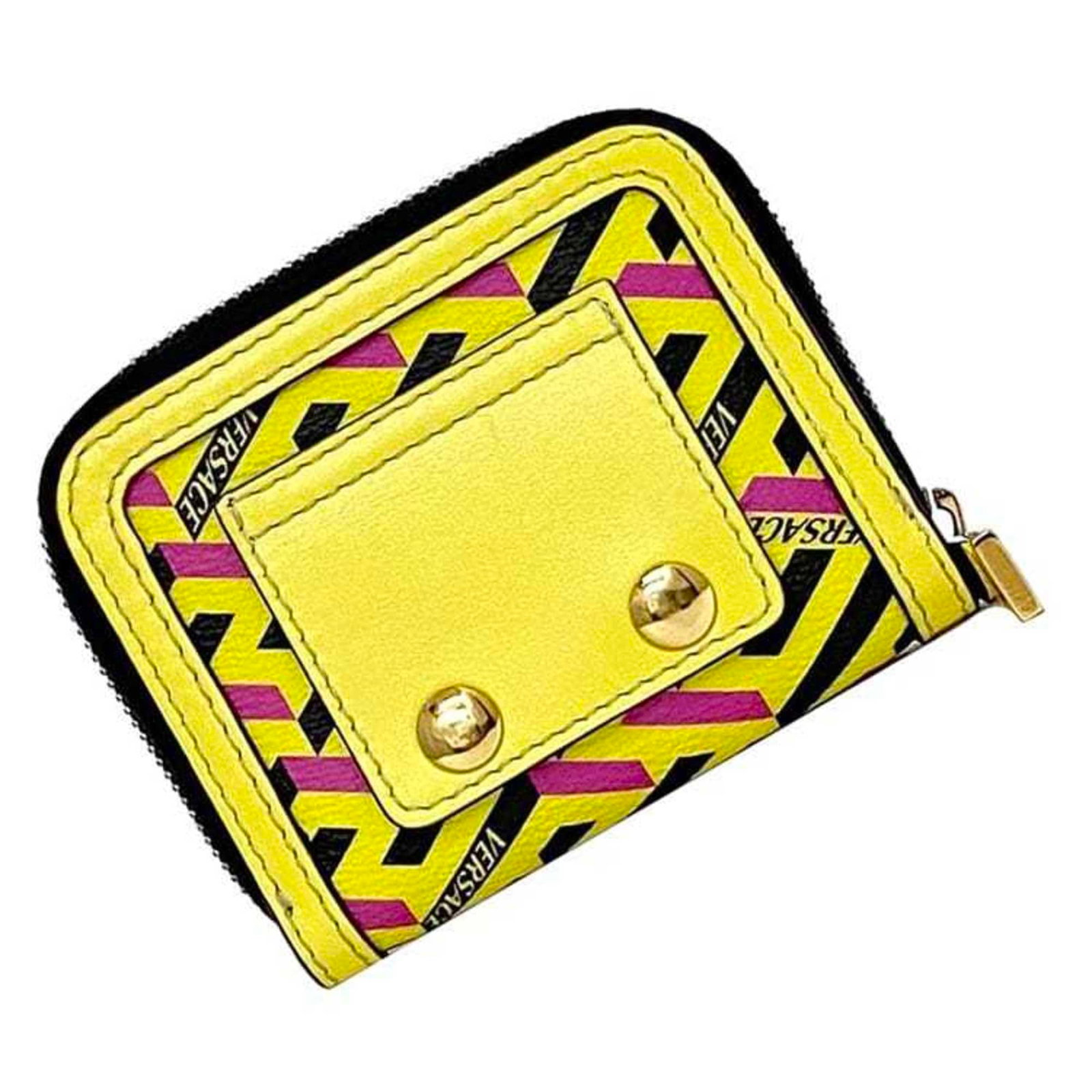Versace Coin Purse/ Coin Case Leather: Versace Coin Purse/ Coin Case Leather The Versace Coin Purse/ Coin Case Leather is a stylish accessory featuring the iconic Italian brand's signature yellow leather. This compact leather case measures