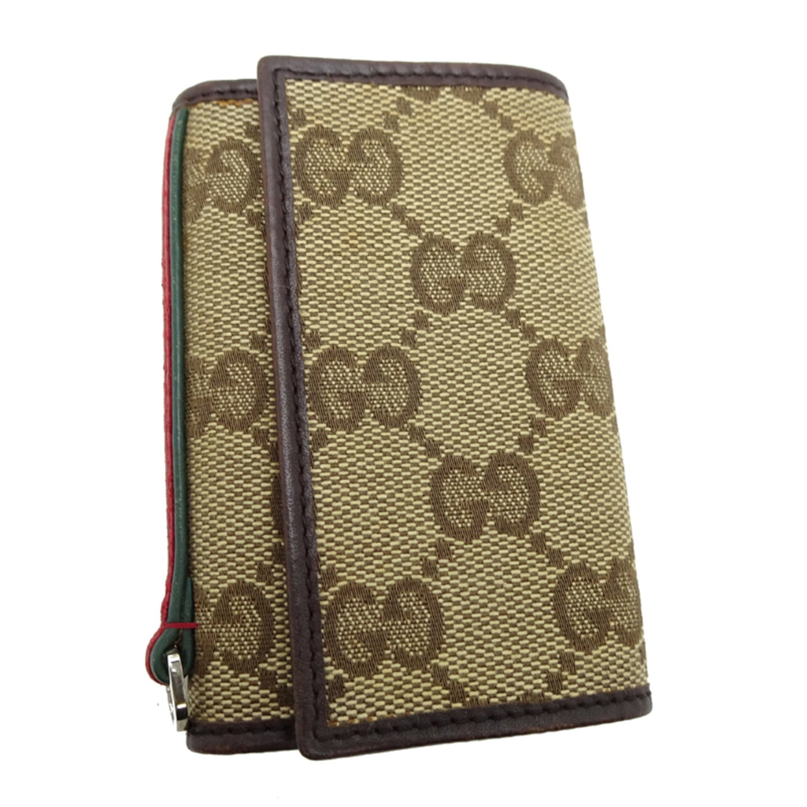 Gucci Canvas Leather Keycase: Gucci Canvas Leather Keycase Gucci's iconic GG canvas and leather combination is showcased in this stylish keycase, available in both Beige and Brown colors. With six key hooks and a compact size,