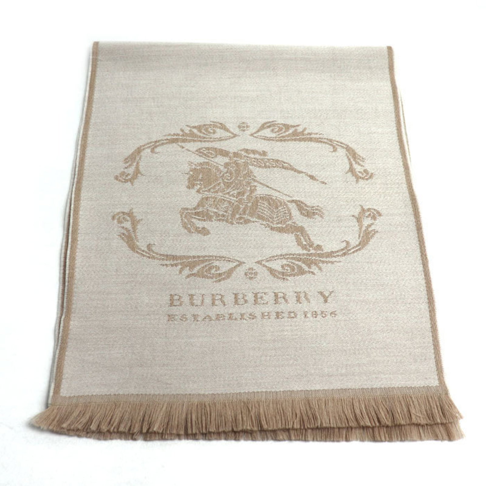 Wool Shawl Burberry: Wool Shawl Burberry This classic wool shawl from Burberry is a timeless piece, crafted from high-quality wool and measuring 1.76m x 36cm in size. Its understated beige color and simple design make it
