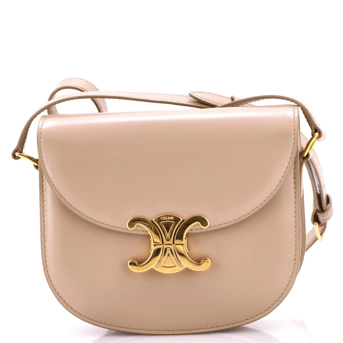 Celine Triomphe Besace Clea Flap Bag Leather: Celine Triomphe Besace Clea Flap Bag Leather Celine Triomphe Besace Clea Flap Bag Leather is a neutral-colored, leather shoulder bag with a gold-tone flap and interior. Measuring 6" high, 7" wide,