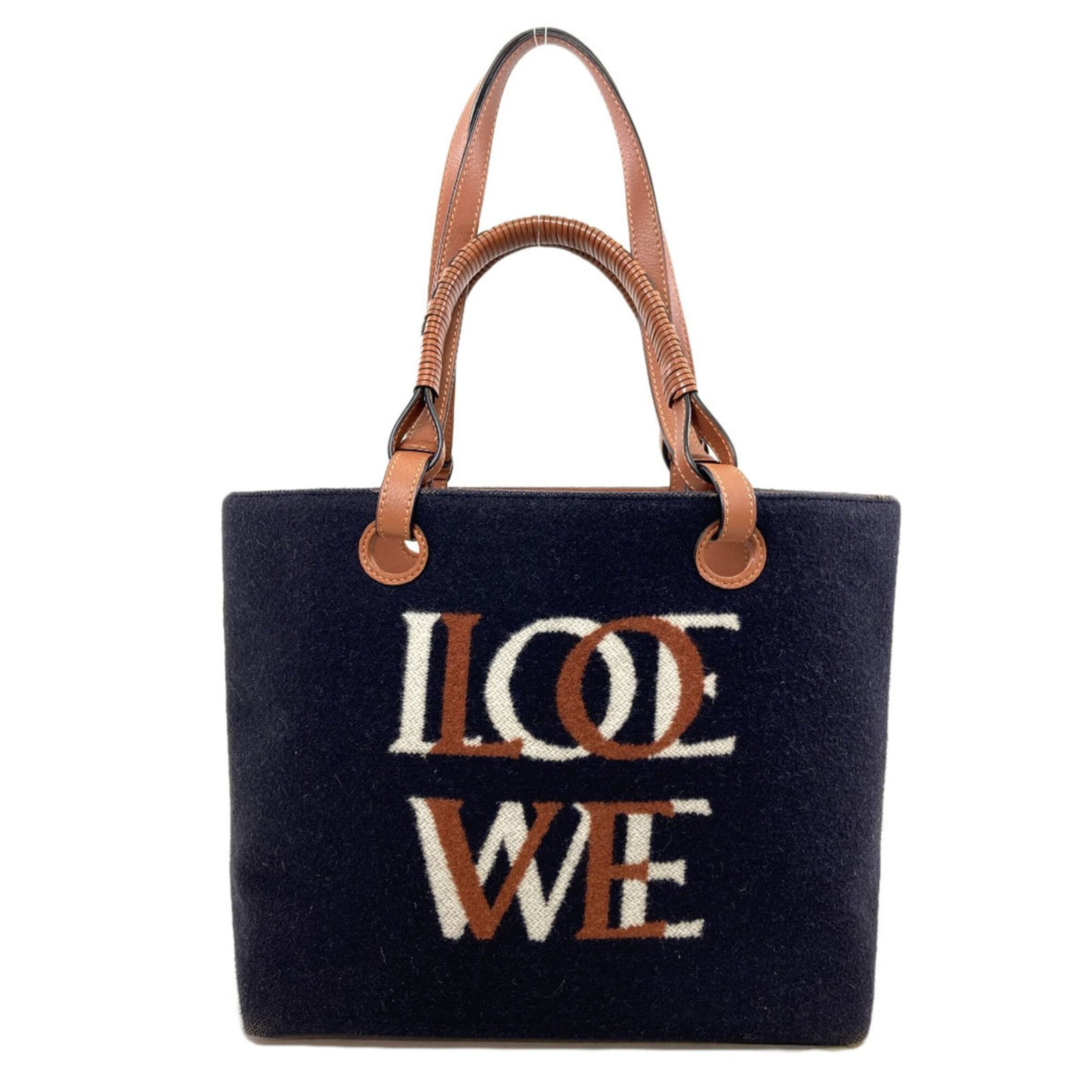 Tote Bag Wool Loewe: Tote Bag Wool Loewe Tote bag made from wool, available in brown and navy colors. Measuring 25cm x 39cm x 14.5cm, this bag features a signature. Item Specifics: Brand: Loewe Type: Tote bag Material: