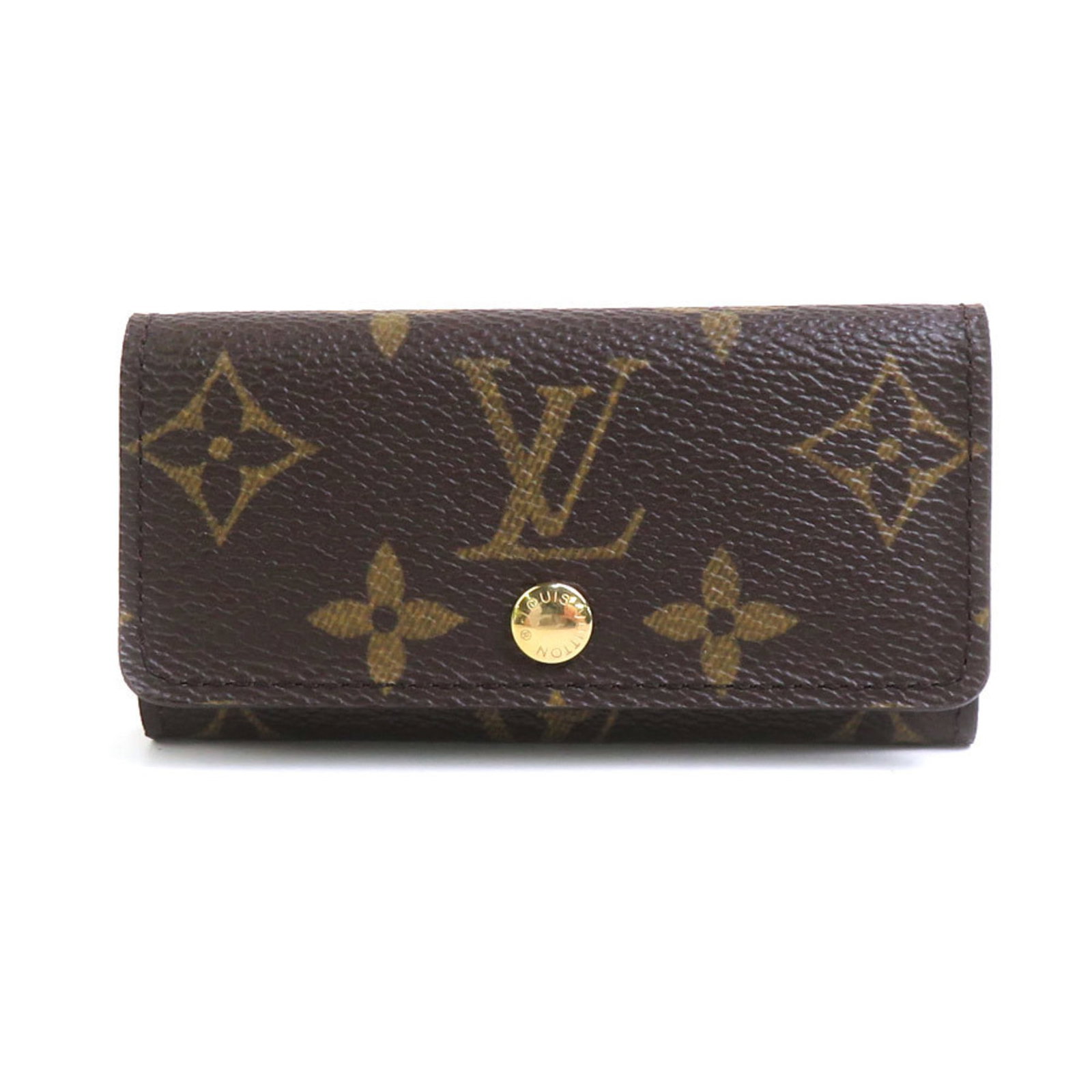 Metal Monogram Keycase Louis Vuitton: Metal Monogram Keycase Louis Vuitton Metal Monogram Keycase Louis Vuitton is made from Monogram material and features a metal construction. It has a brown color and a distinctive Monogram pattern.