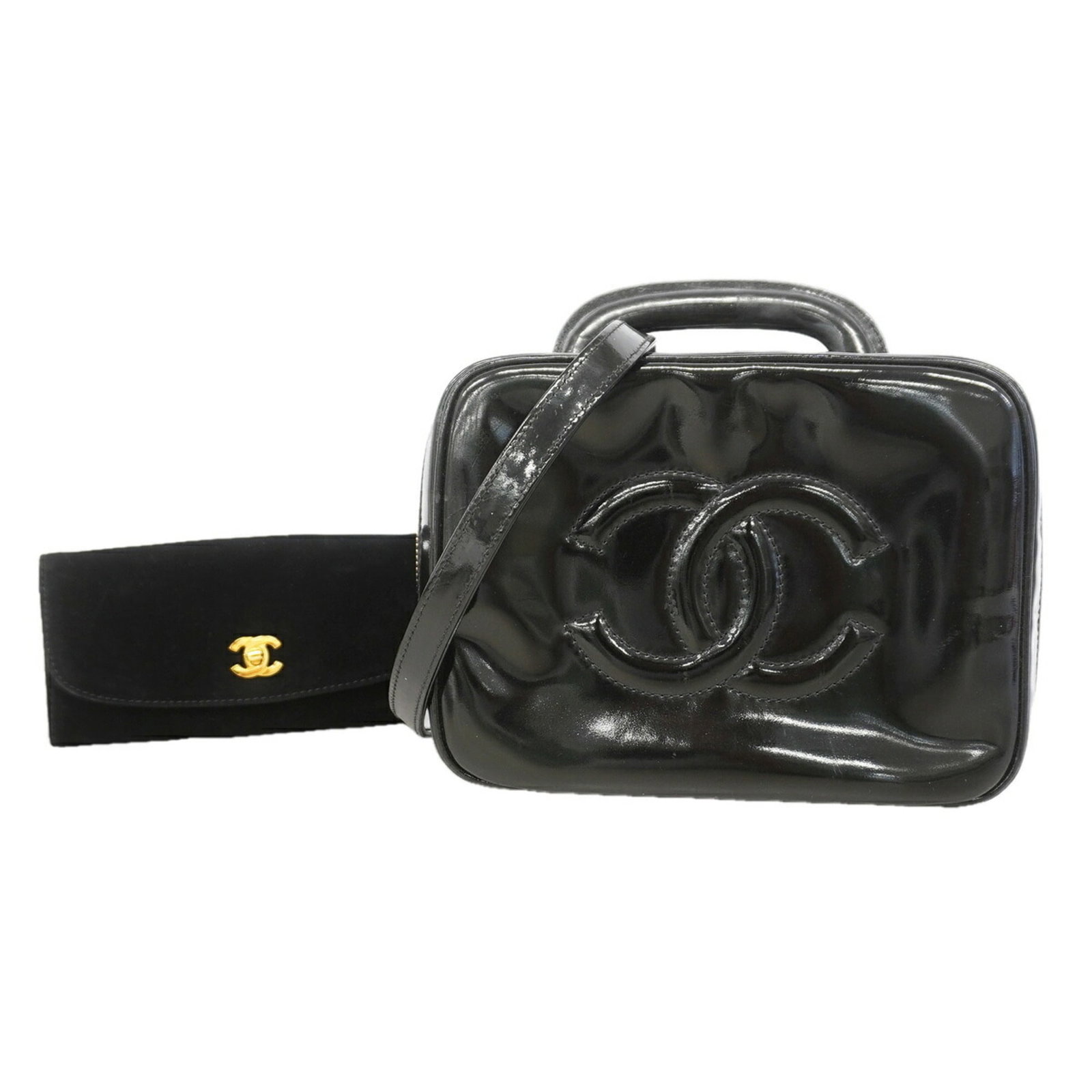 Vanity Bag Patent Leather By Chanel: Vanity Bag Patent Leather By Chanel Patent leather exterior, gold hardware, and a sleek black finish make this Chanel vanity bag a stylish accessory. Measuring 15cm x 20cm x 10cm, it's a compact and