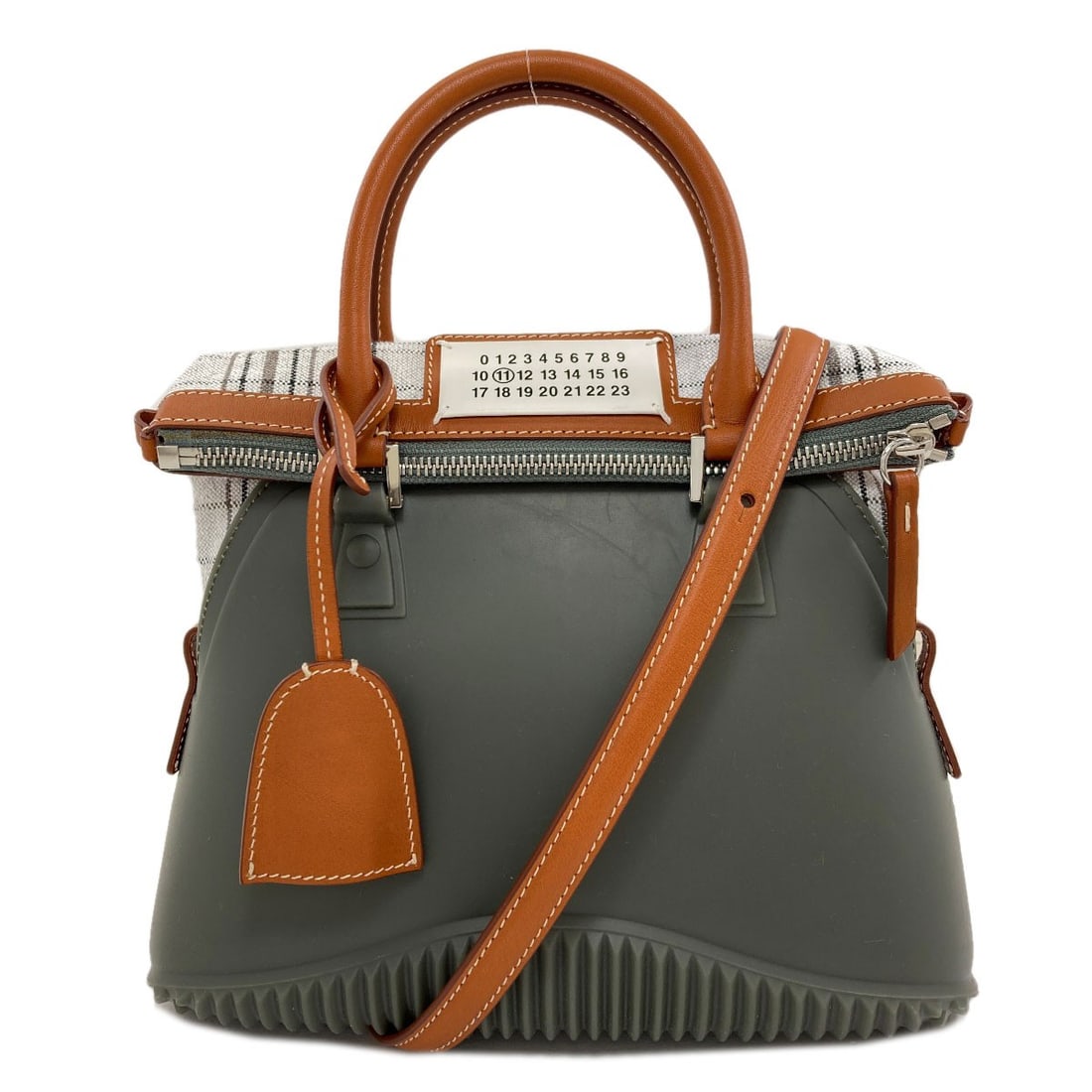 Maisonmargiela 5Ac 2Way Handbag Rubber Canvas: Maisonmargiela 5Ac 2Way Handbag Rubber Canvas The Maison Margiela 5Ac 2Way Handbag features a striking rubber canvas exterior in a sleek gray color. Notable for its unique material, this handbag