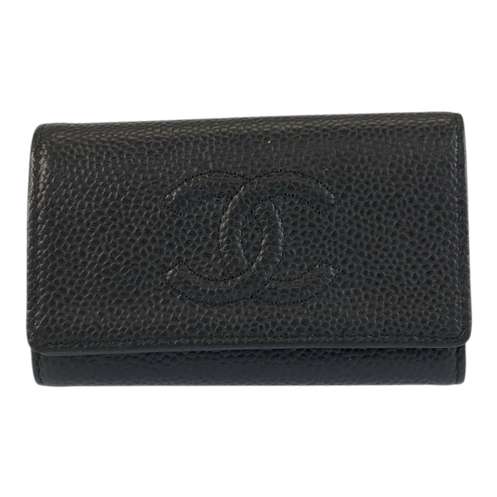 Keycase leather by Chanel: Keycase leather by Chanel Black leather keycase by Chanel, made in France, features a classic design with a button closure and comes in a luxurious box. The compact size makes it a convenient