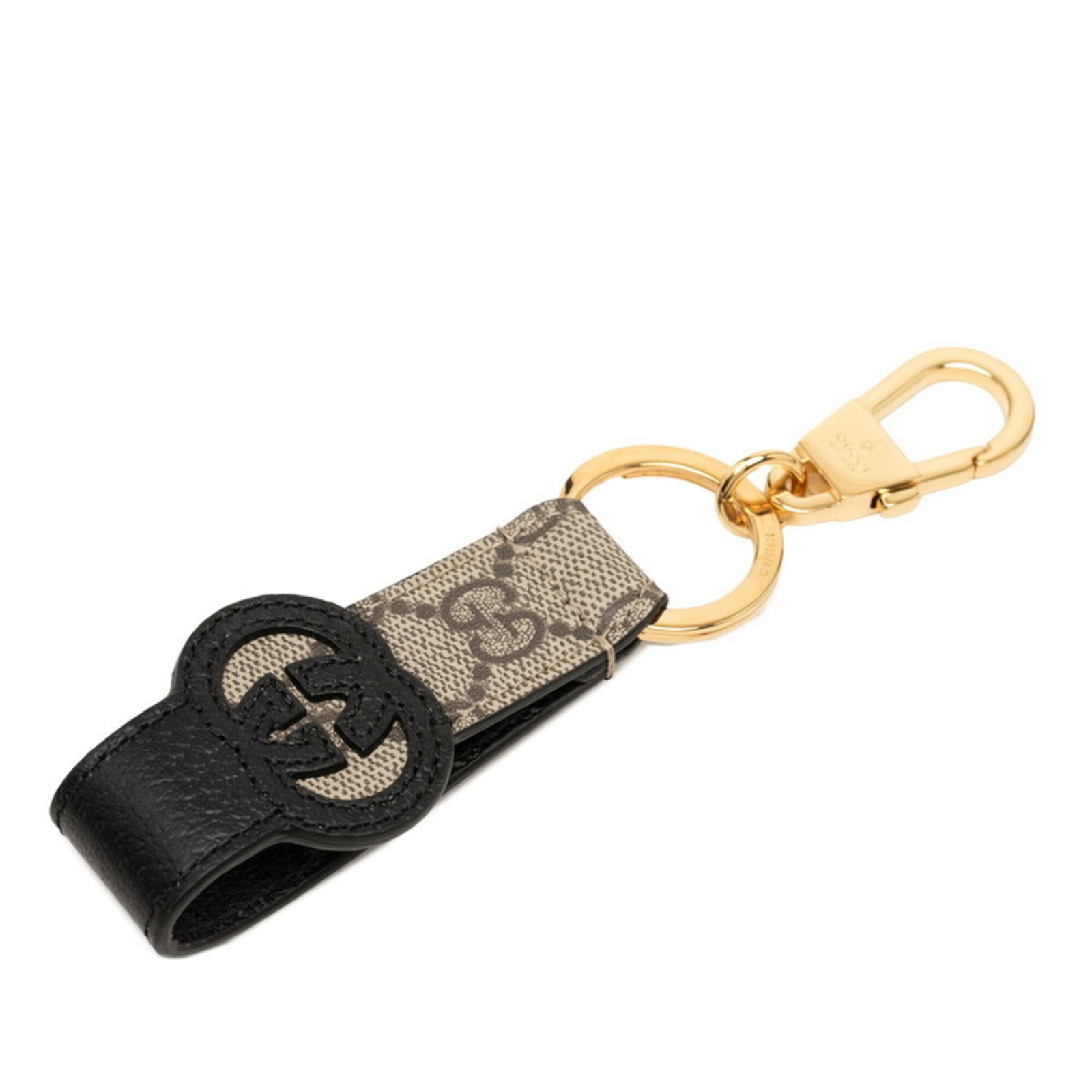 Keyring Leather: Keyring Leather The Gucci MPN 701432 keyring is crafted from high-quality leather, available in two stylish colors: beige and black. Measuring 15.5cm x 4.2cm, this sleek keyring features a classic des