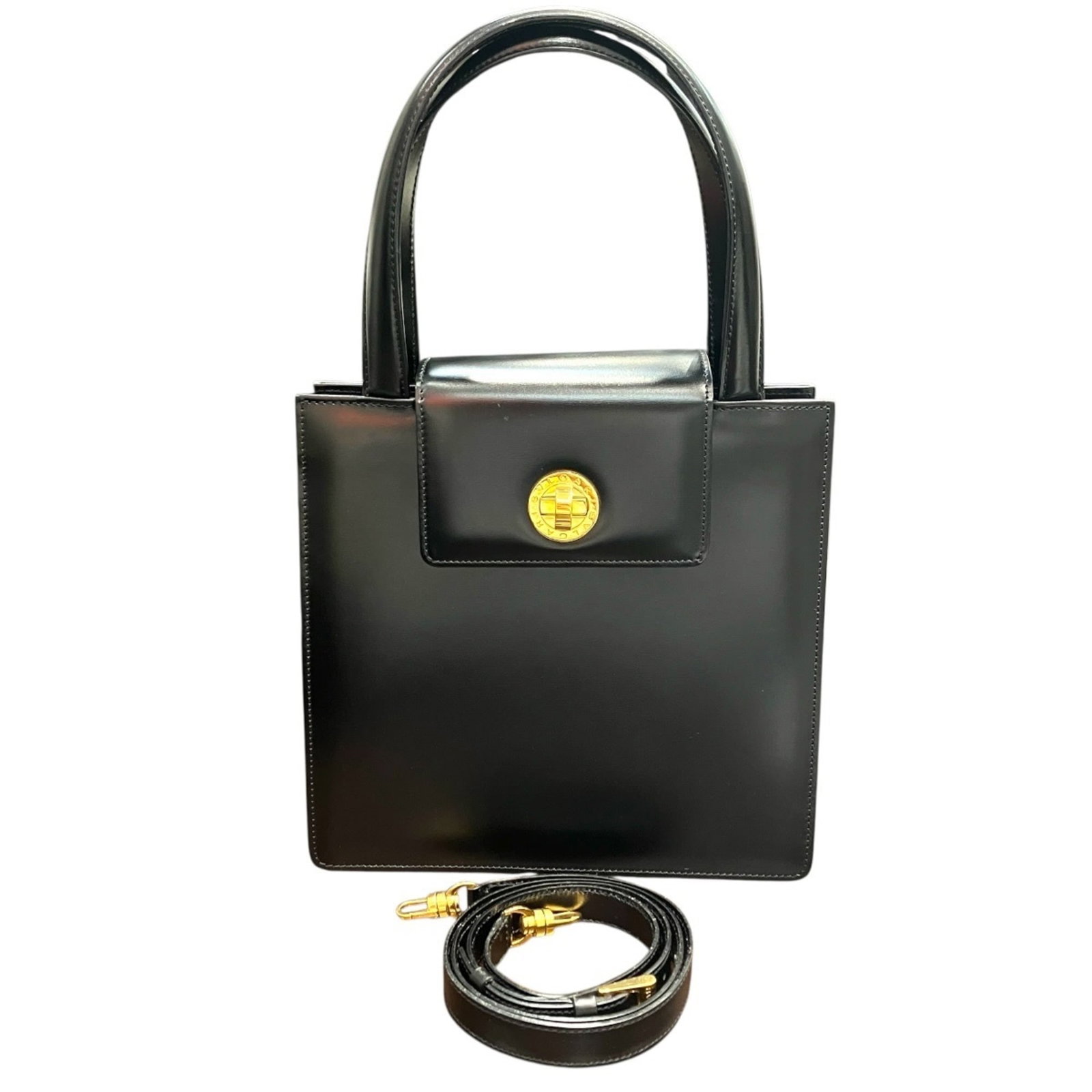 Handbag Leather Bvlgari: Handbag Leather Bvlgari 23cm x 24cm x 10cm / 9.05'' x 9.44'' x 3.93'' Bvlgari leather handbag with turn lock closure, available in a range of strap lengths from 106cm to 114cm. This stylish handbag