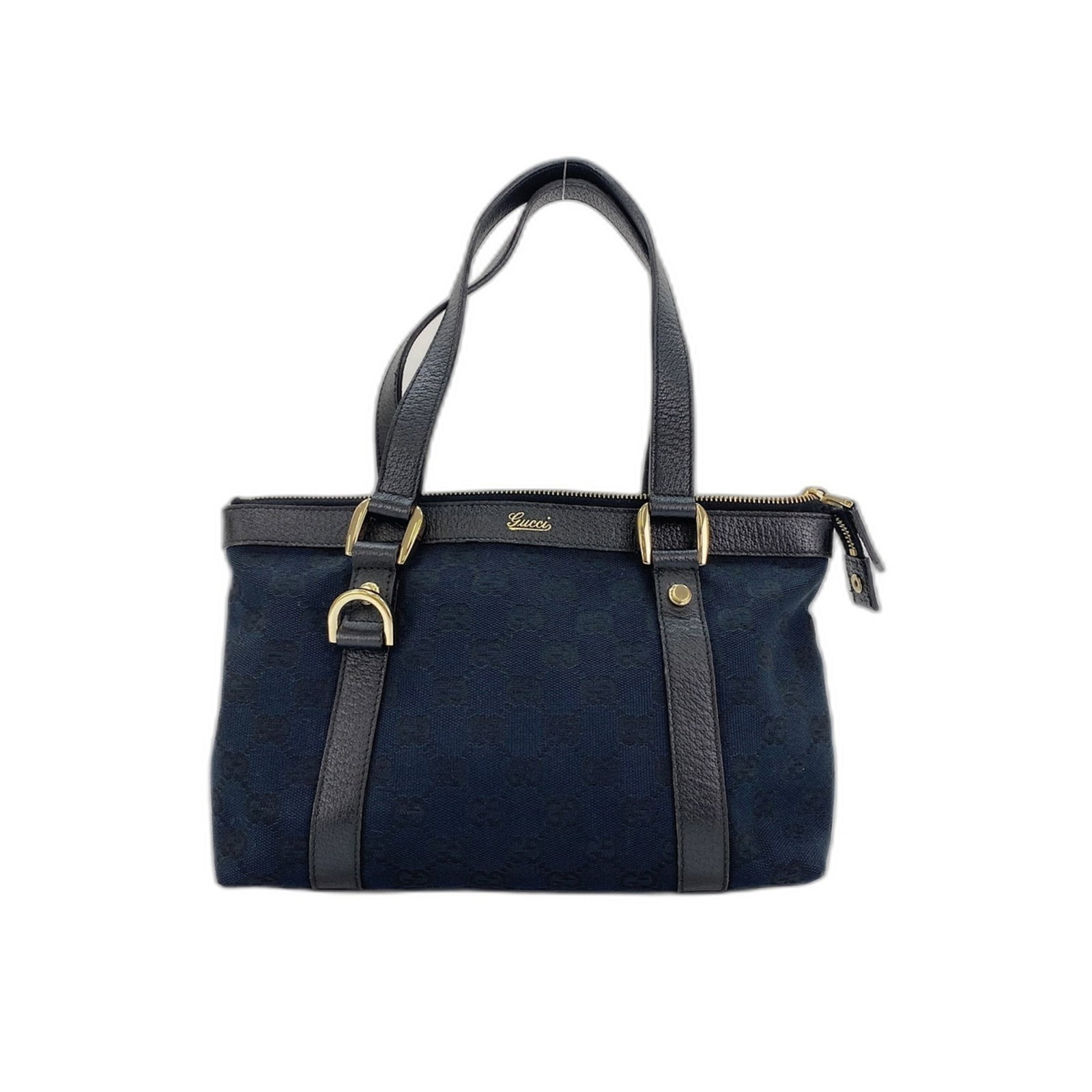 Gucci Canvas Handbag: Gucci Canvas Handbag Gucci's iconic GG canvas handbag boasts a sleek, clear design paired with a navy hue, making for a timeless and versatile accessory. Measuring 17cm x 25cm x 8cm, this stylish bag