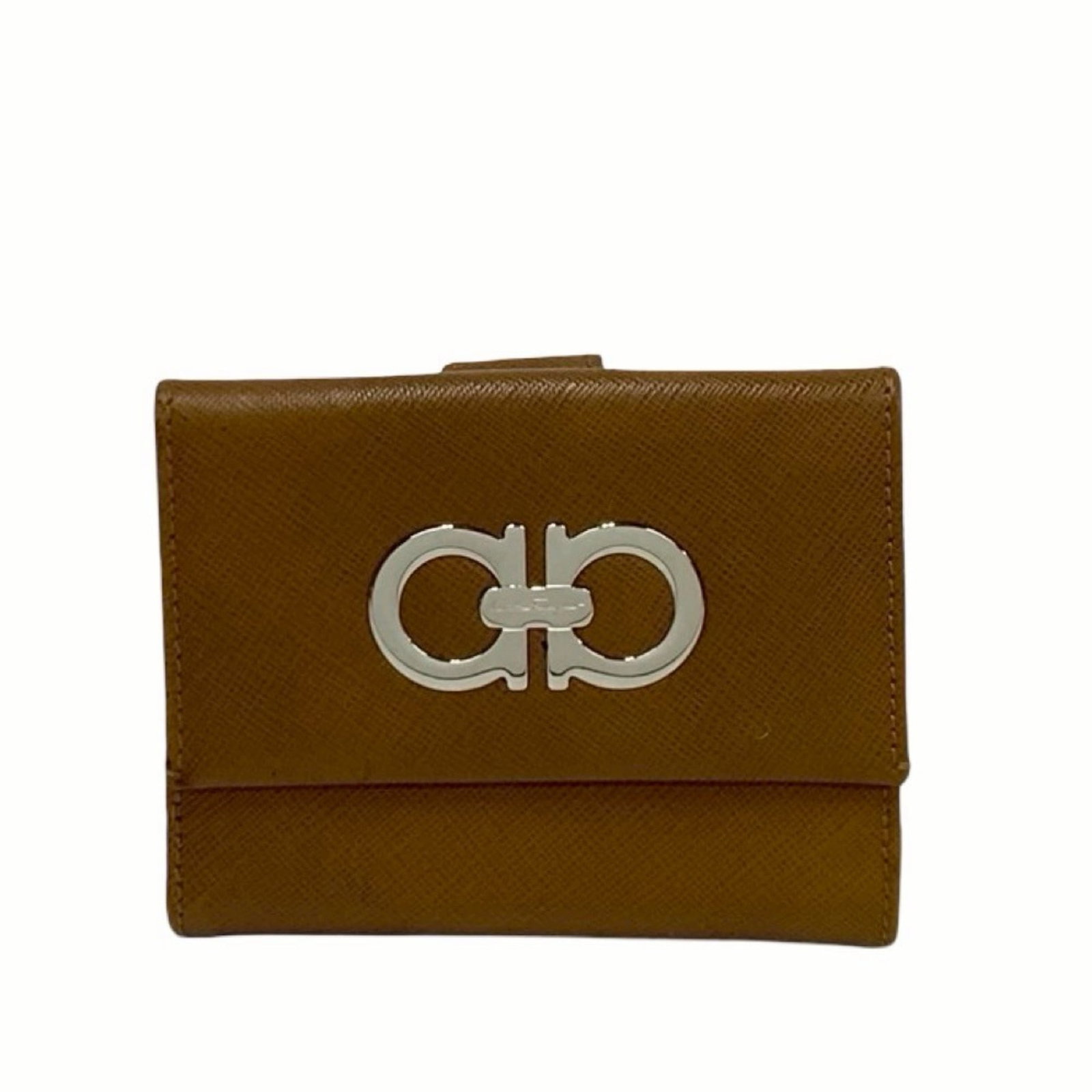 Salvatore Ferragamo Leather Wallet Bi-Fold: Salvatore Ferragamo Leather Wallet Bi-Fold Salvatore Ferragamo Leather Wallet Bi-Fold is a high-quality, brown leather wallet with a classic bi-fold design. Measuring 9cm x 11cm x 2cm, it features a