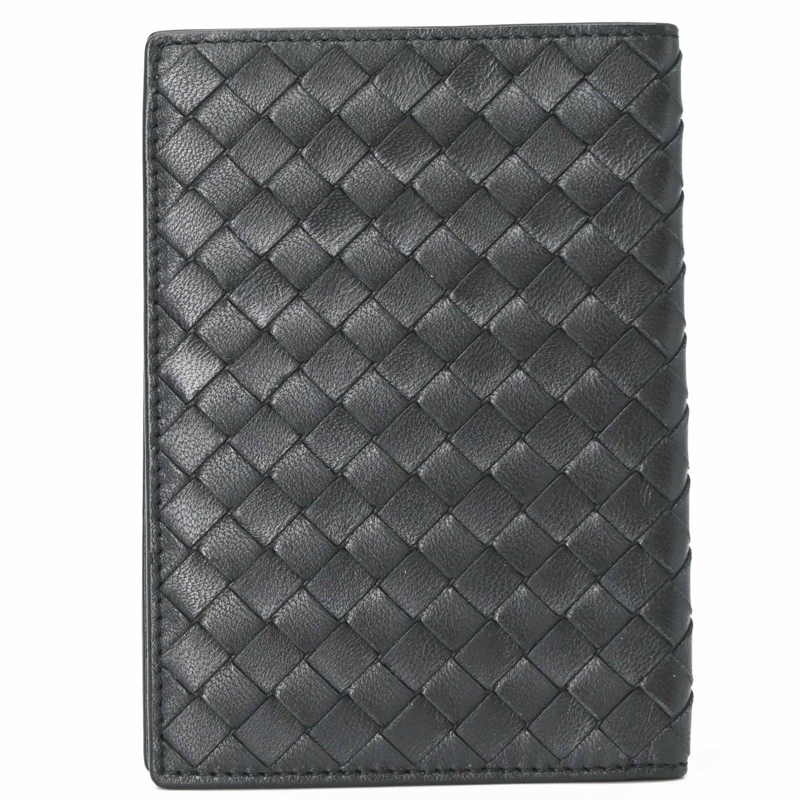 Passport Cover By Bottega Veneta: Passport Cover By Bottega Veneta Bottega Veneta's Intrecciato passport cover is a sleek and sophisticated accessory, featuring the iconic woven leather design. Made from high-quality black leather,