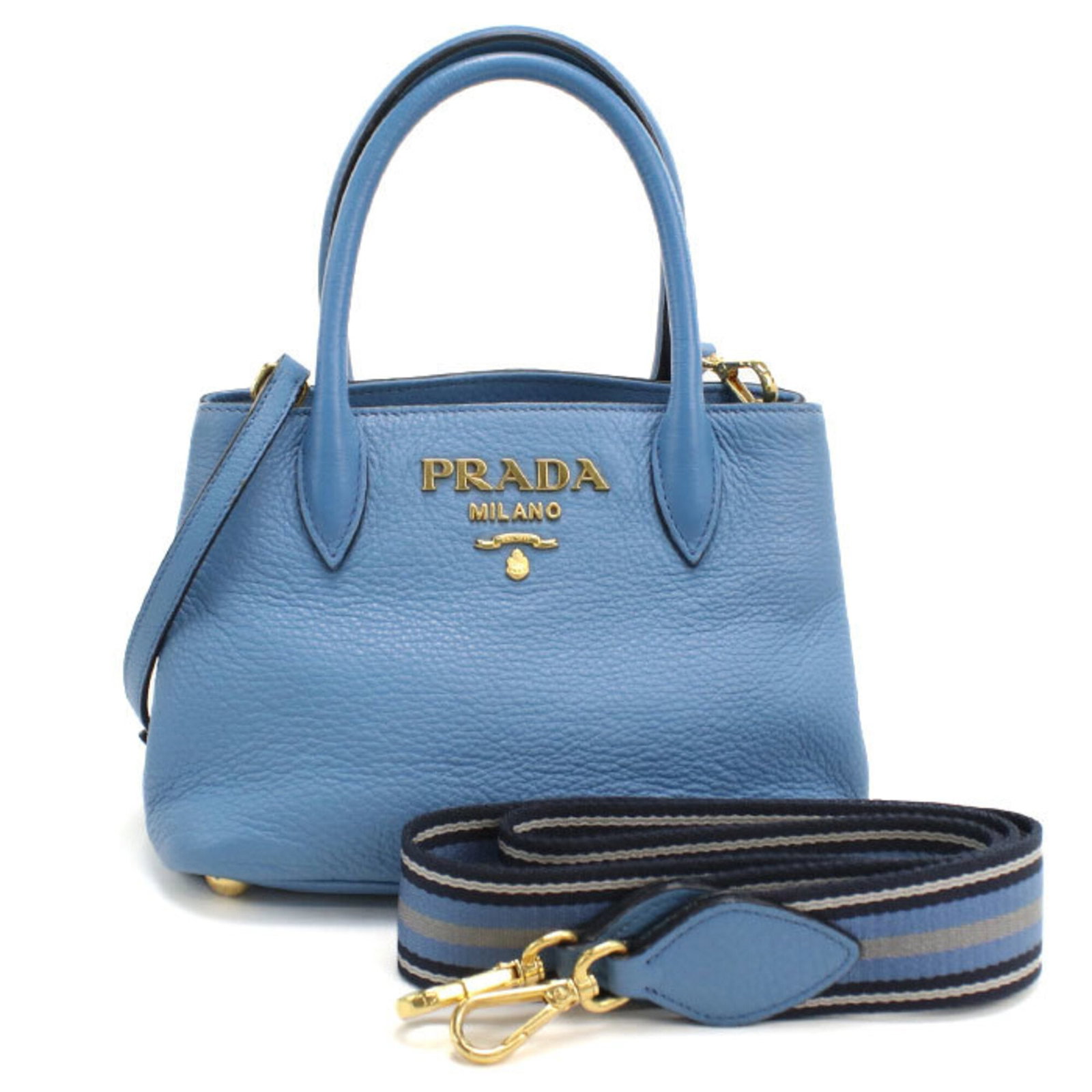 Handbag Leather Prada: Handbag Leather Prada Handbag with blue leather and gold hardware, measuring 14cm x 21cm x 10cm, made from high-quality leather and featuring a classic design. This Italian-made Prada handbag is a