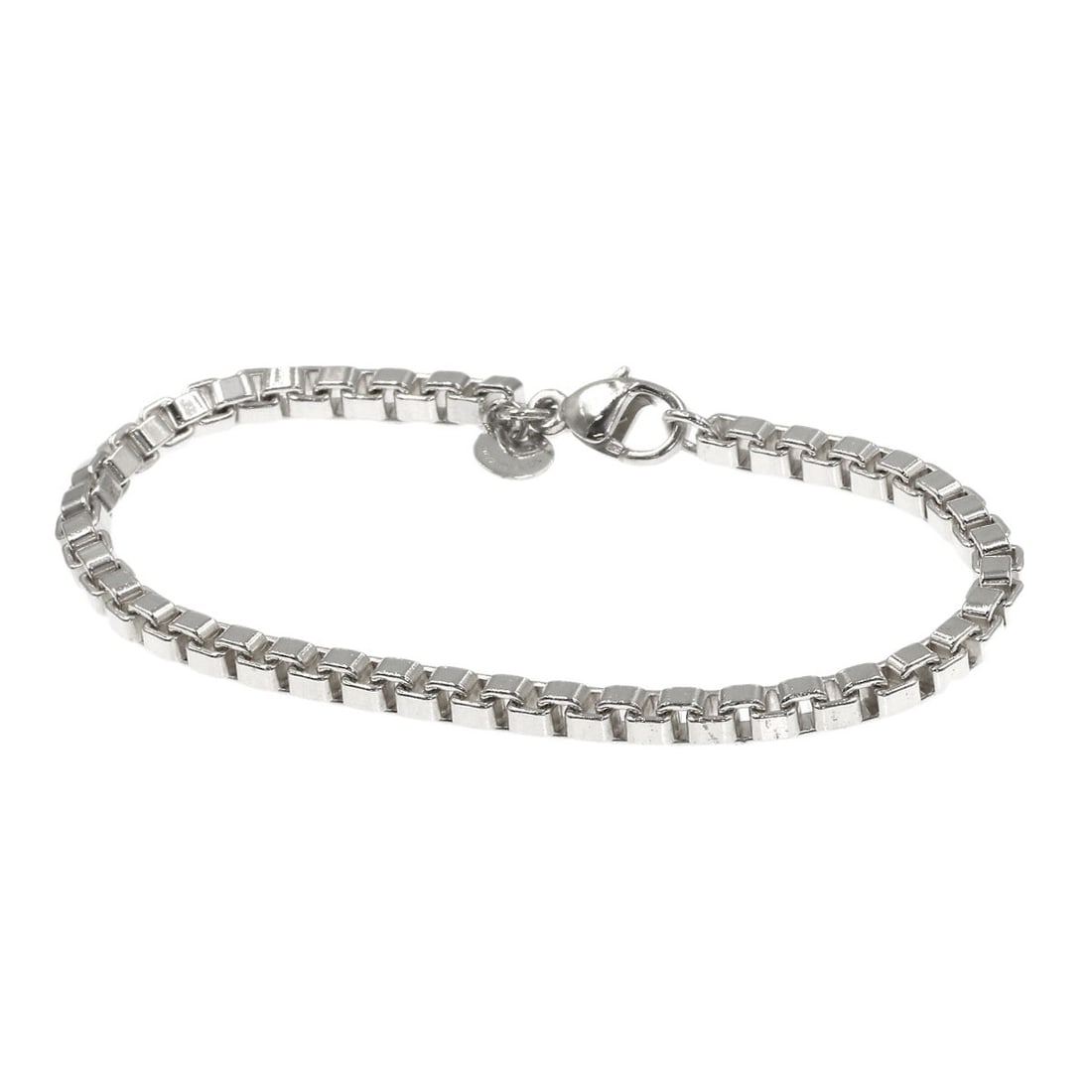 Venetian Silver Tiffany Co. Bracelet: Venetian Silver Tiffany Co. Bracelet Tiffany & Co.'s Venetian Silver bracelet is a sleek and sophisticated accessory, crafted from high-quality silver metal. With its elegant design and understated