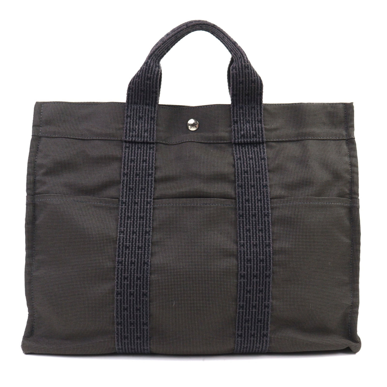 Polyester polyamide bag tote Hermes: Polyester polyamide bag tote Hermes Polyester polyamide bag tote from the Hermes Line, designed with a sleek gray color and silver hardware, features a sturdy zipper closure and two open pockets for a