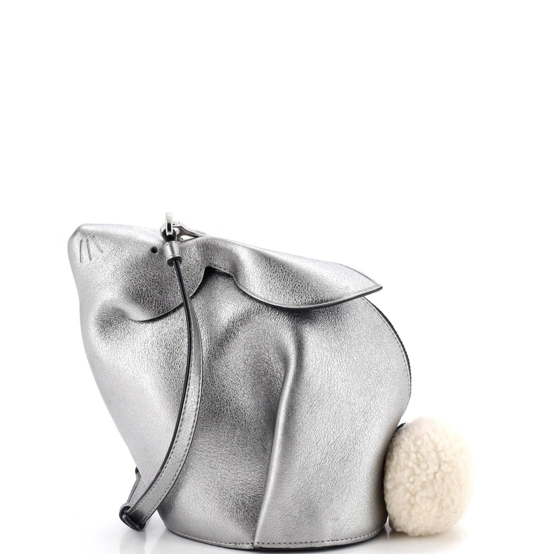 Mini Leather Rabbit Crossbody Bag Loewe: Mini Leather Rabbit Crossbody Bag Loewe Miniature in size, this metallic leather shearling crossbody bag from Loewe boasts a chic, rabbit-inspired design. With its sleek, metallic exterior and black