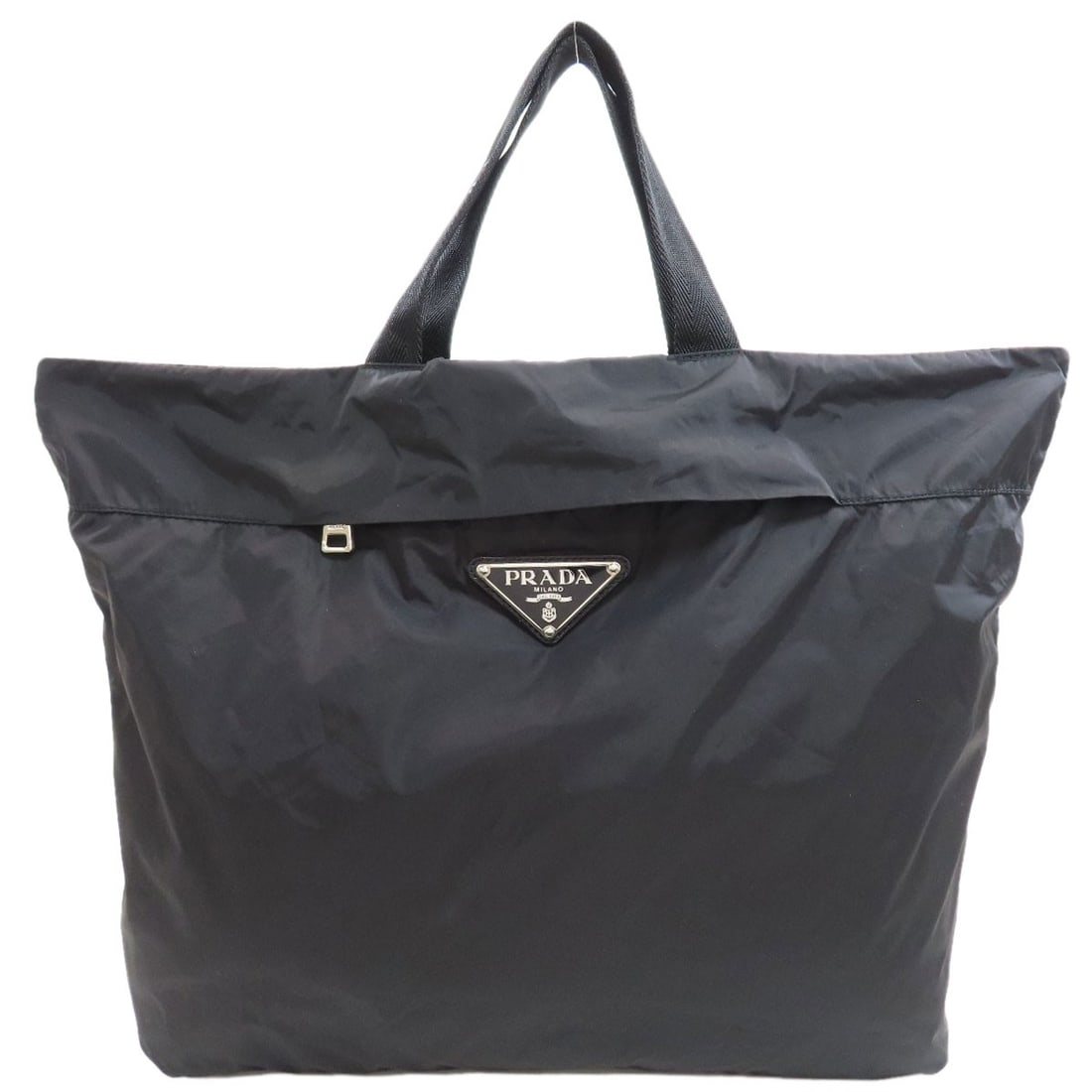 Prada Eco Bag Logo Hardware Handbag Nylon: Prada Eco Bag Logo Hardware Handbag Nylon Black Prada Eco Bag Logo Hardware Handbag made from Nylon. This handbag features a logo hardware design, standing out with its bold and sleek aesthetic. The n