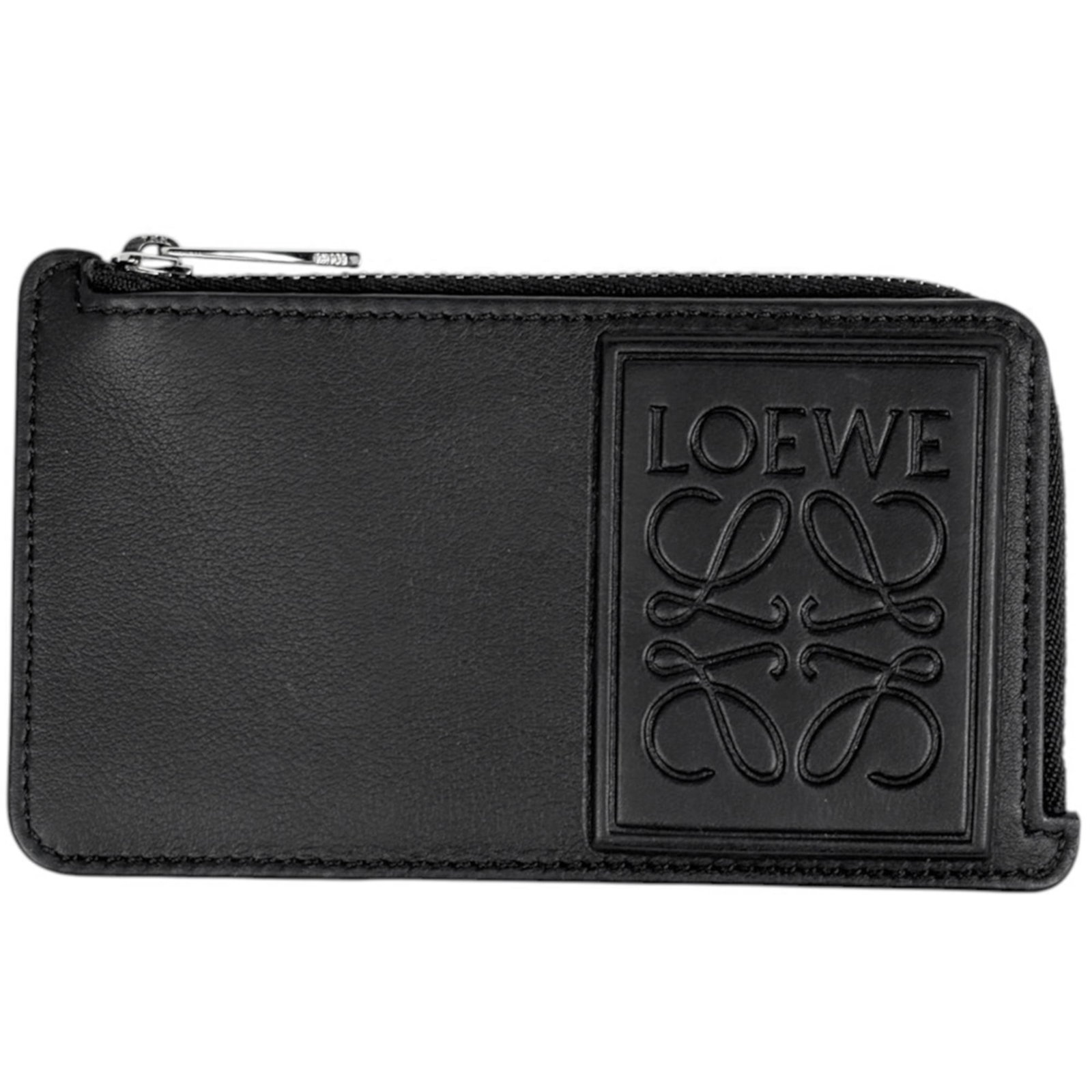 Card Case Leather by Loewe: Card Case Leather by Loewe Card case by Loewe, crafted from high-quality black leather, measures 7cm x 13cm x 1.5cm. The sleek design makes it a versatile accessory for everyday use. Made from durable