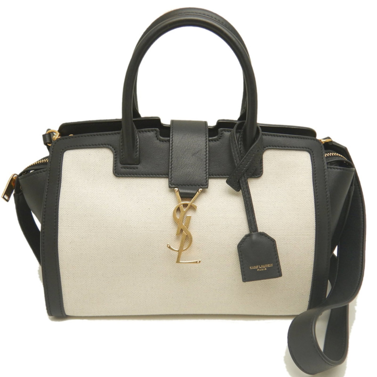 Yves Saint Laurent Leather Canvas Handbag: Yves Saint Laurent Leather Canvas Handbag Black and White Yves Saint Laurent Leather Canvas Handbag. This sleek, 17.5cm x 34cm x 12cm handbag features a striking combination of canvas and leather,