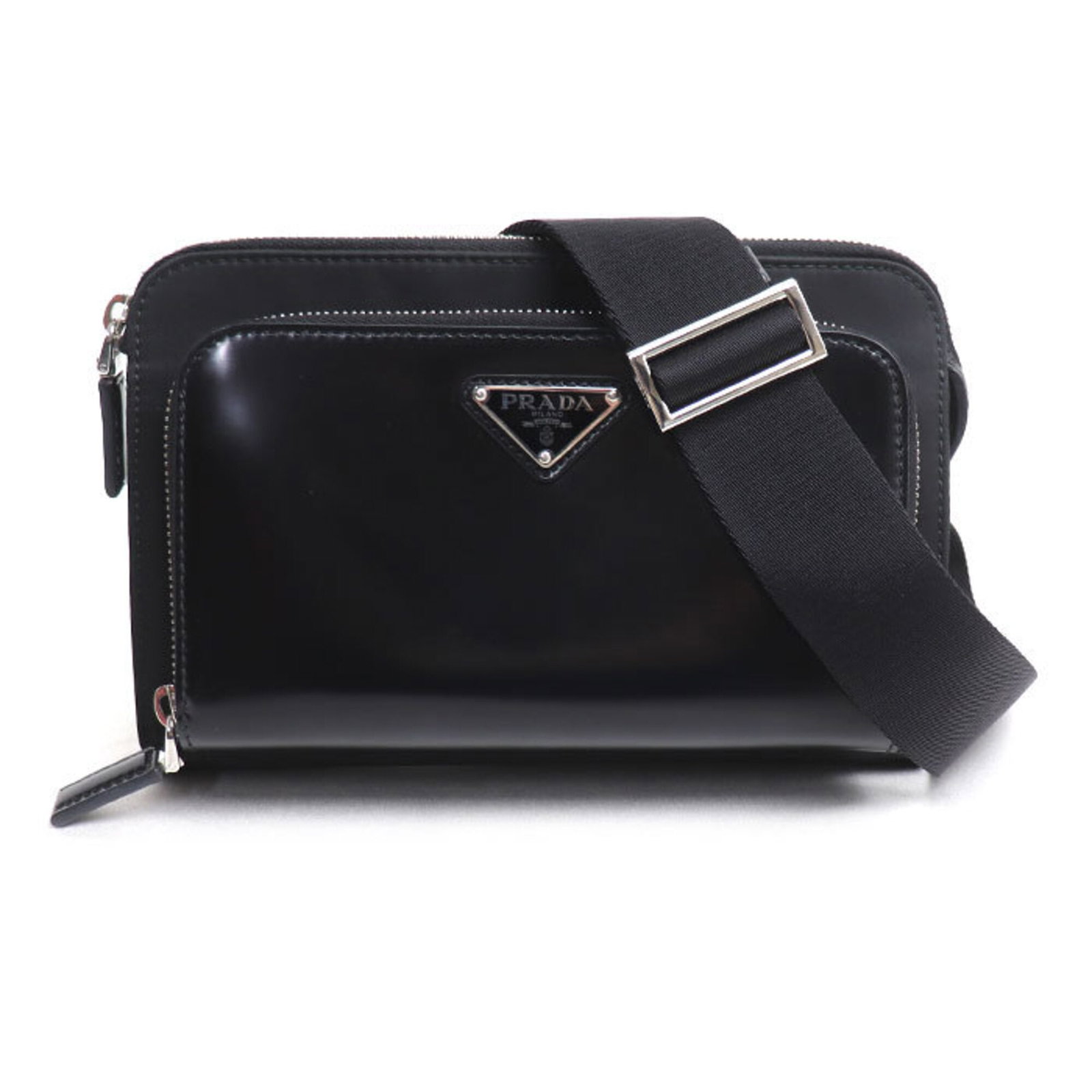 Shoulder Bag Nylon Leather Prada: Shoulder Bag Nylon Leather Prada Black leather and nylon shoulder bag from Prada, Italy, with silver hardware and a size of 14cm x 22cm x 3.5cm. This bag features a unique combination of materials