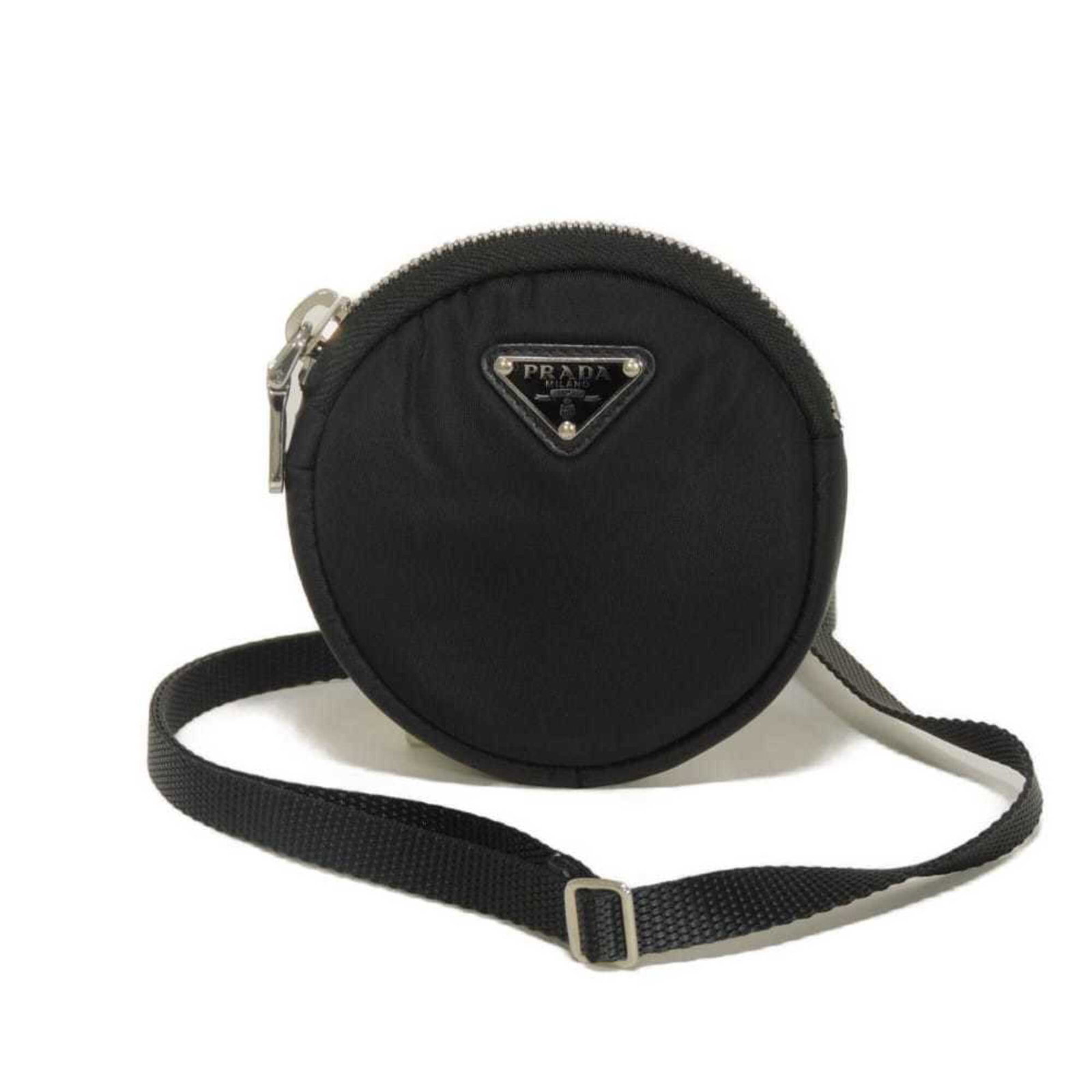 Shoulder Bag Nylon: Shoulder Bag Nylon Black Prada Nylon Shoulder Bag. Made from durable nylon, this bag features silver hardware and adjustable straps for a customizable fit. Weighing just 82g, it's a compact and lightw