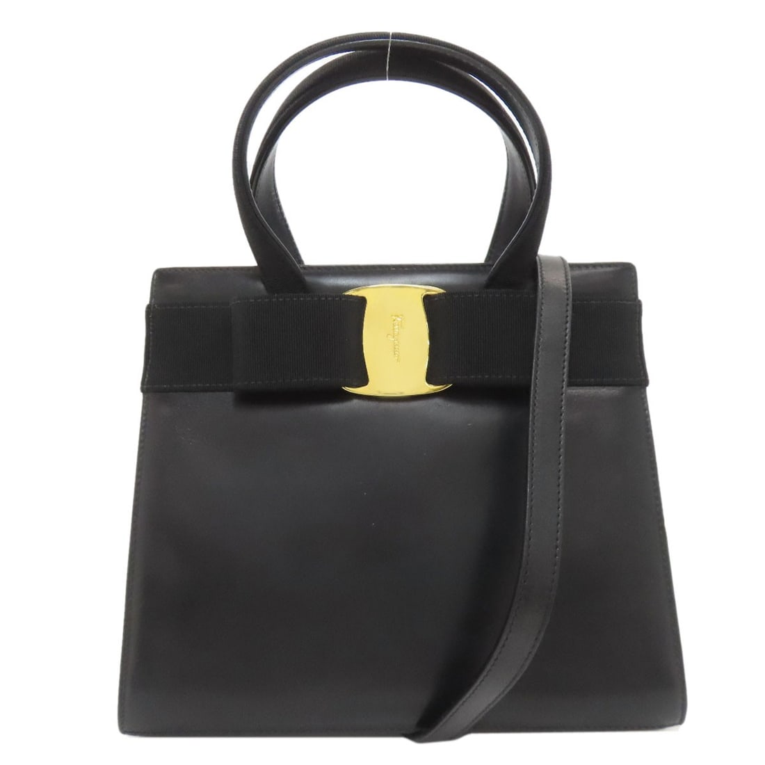Ferragamo Vala Ribbon Salvatore Handbag Leather: Ferragamo Vala Ribbon Salvatore Handbag Leather Black leather Salvatore Ferragamo Vala ribbon handbag with a sleek, sophisticated design. The classic black exterior and high-quality leather