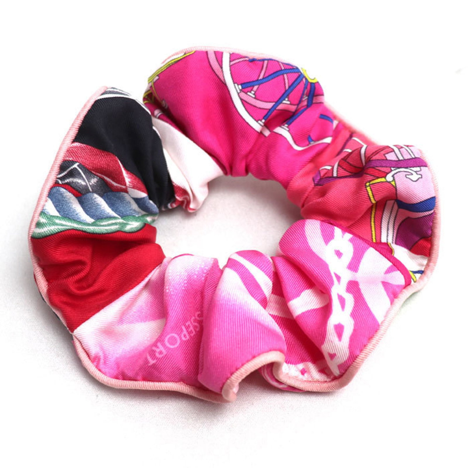 Hermes Silk Scrunchie: Hermes Silk Scrunchie Silk from France, this Hermes scrunchie boasts a vibrant multi-color design and a delicate pink hue. Made from luxurious silk, its compact size measures 13cm x 4.5cm. Arriving in