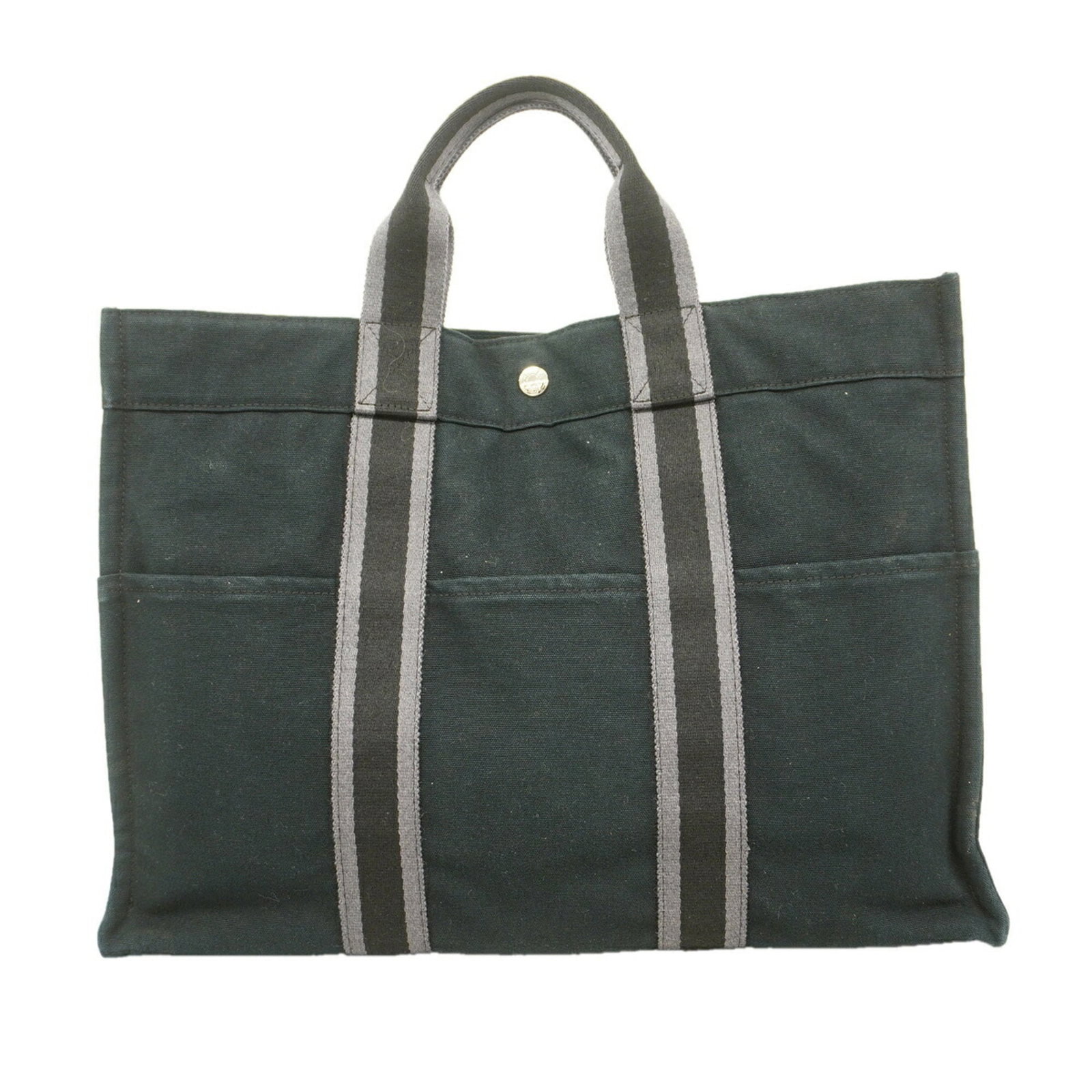Canvas tote bag Hermes: Canvas tote bag Hermes Canvas tote bag from Hermes, made from high-quality canvas material, features a sleek black design with silver hardware. This stylish tote bag measures 32cm x 42.5cm x 10.5cm an