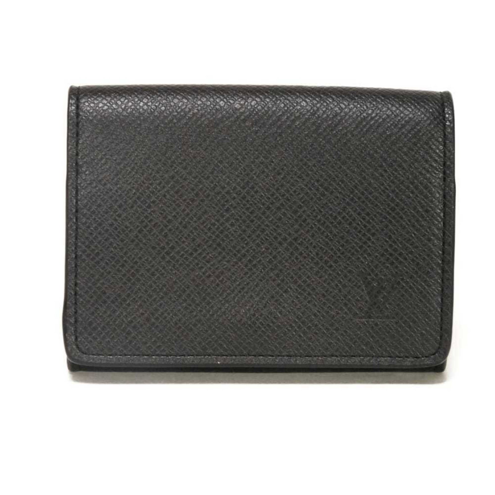 Taiga Leather Louis Vuitton Card Case: Taiga Leather Louis Vuitton Card Case Taiga Leather Louis Vuitton Card Case, made from high-quality Taiga leather, features a sleek and sophisticated design with a classic black color. Measuring 7.8cm