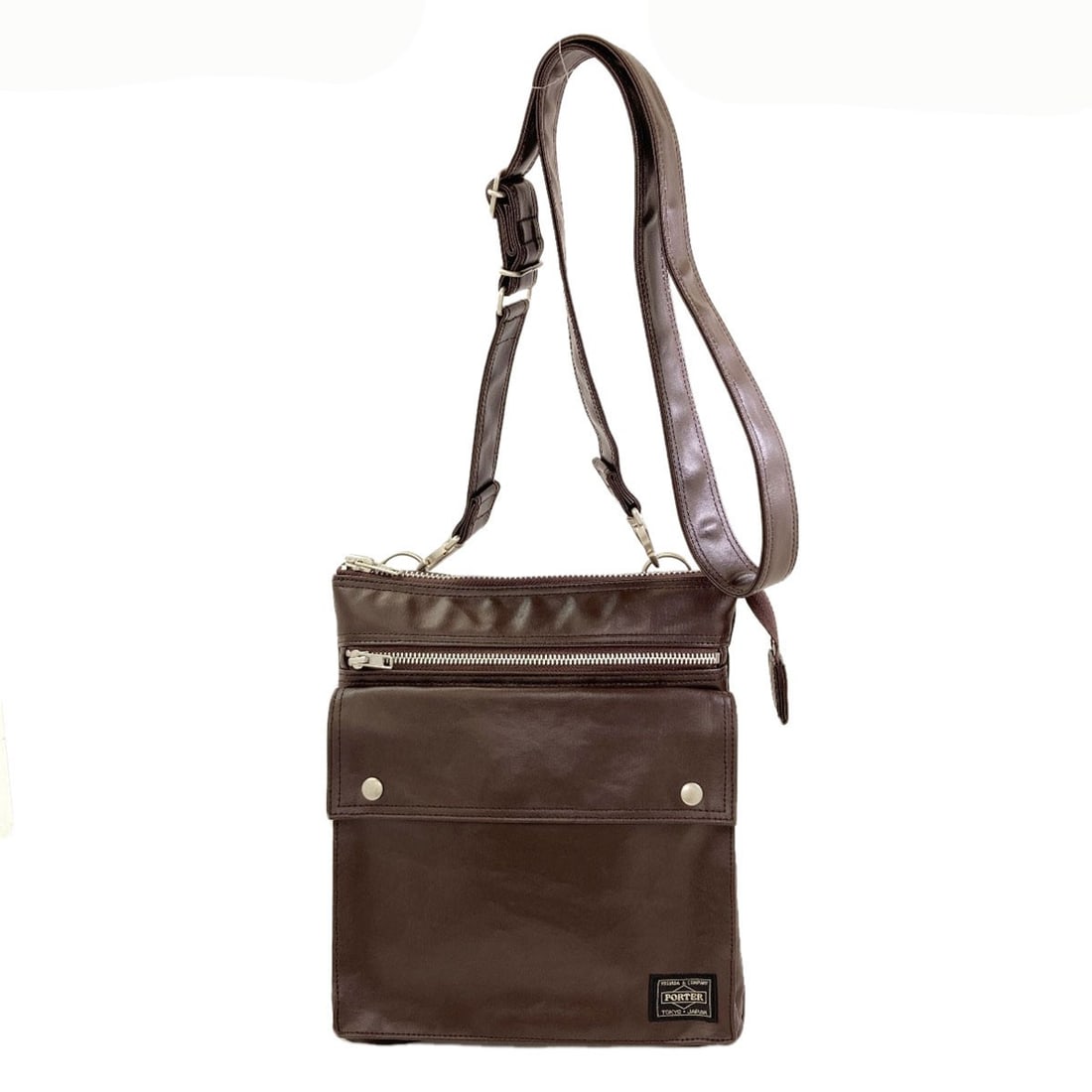 Porter Free Style Shoulder Bag Coating Canvas: Porter Free Style Shoulder Bag Coating Canvas Porter Free Style Shoulder Bag Coating Canvas is a brown shoulder bag made from coating canvas. Its exterior features a brown color. The bag's exterior