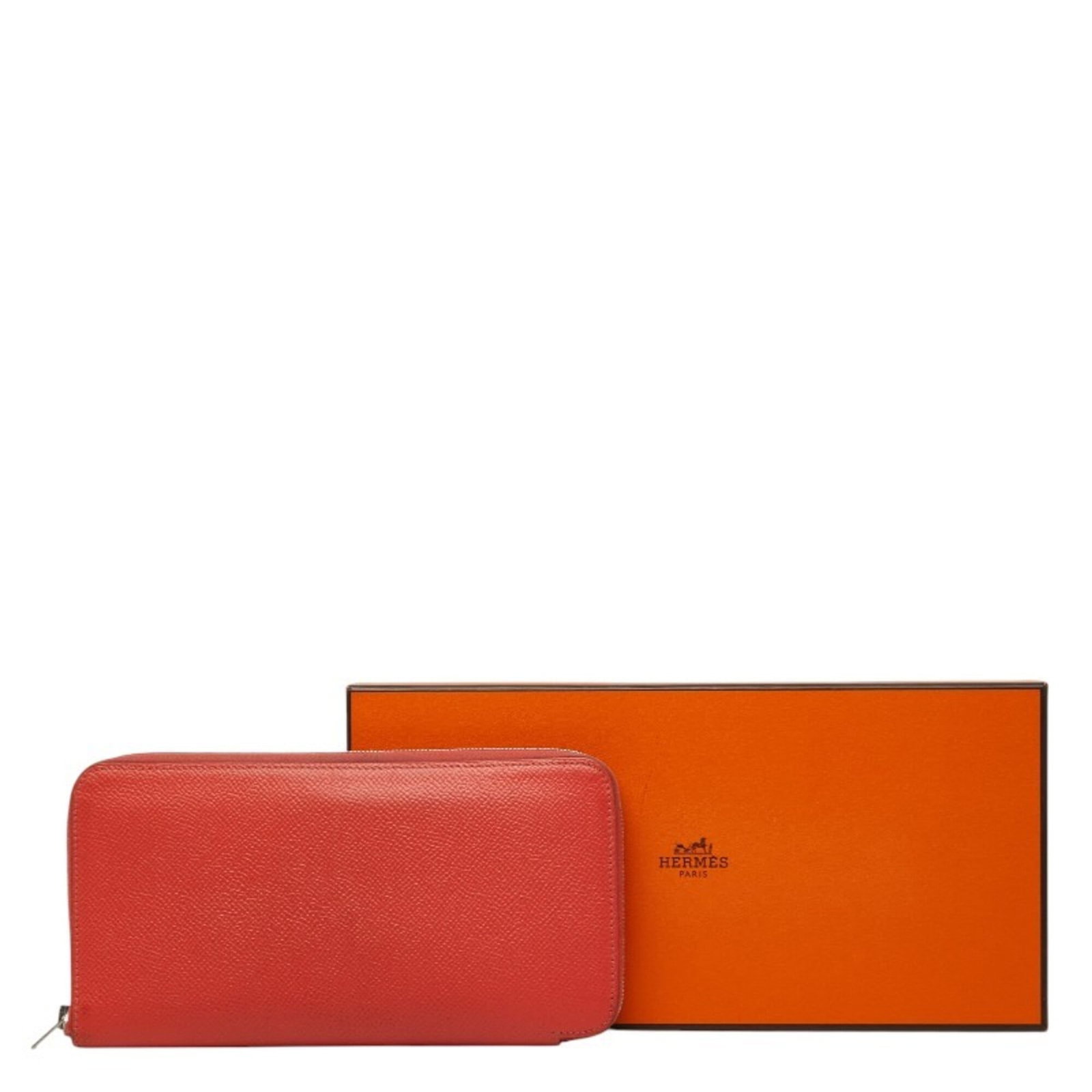 Epsom Leather Bi fold Wallet Hermes: Epsom Leather Bi fold Wallet Hermes Epsom leather, a luxurious material, is used to craft this bi-fold wallet from the Hermes line. The wallet features a striking red color and a zipper closure,